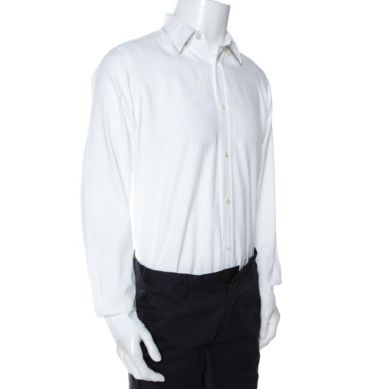 A crisp white shirt is a must-have for every closet. This version from Louis Vuitton is a great example of a well-tailored white shirt. Crafted from 100% cotton, it is styled simply and is great for formal occasions and weekdays. It comes with a