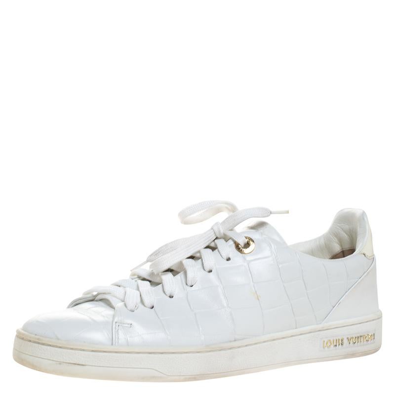 You'll love wearing these Frontrow sneakers from Louis Vuitton! The white sneakers are crafted from croc-embossed leather and feature round toes and lace-up on the vamps. They come equipped with comfortable leather-lined insoles and tough soles.

