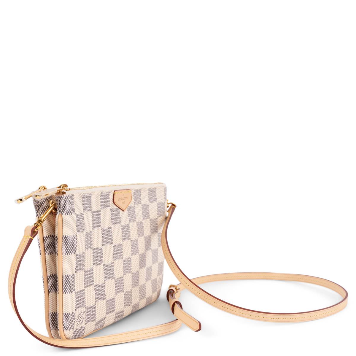 100% authentic Louis Vuitton Double Zip pochette in Damier Azur canvas. Features removable and adjustable natural cowhide leather strap, trims and logo tab and gold-tone hardware. Two zipped pockets with open pocket in the middle. Lined in pink