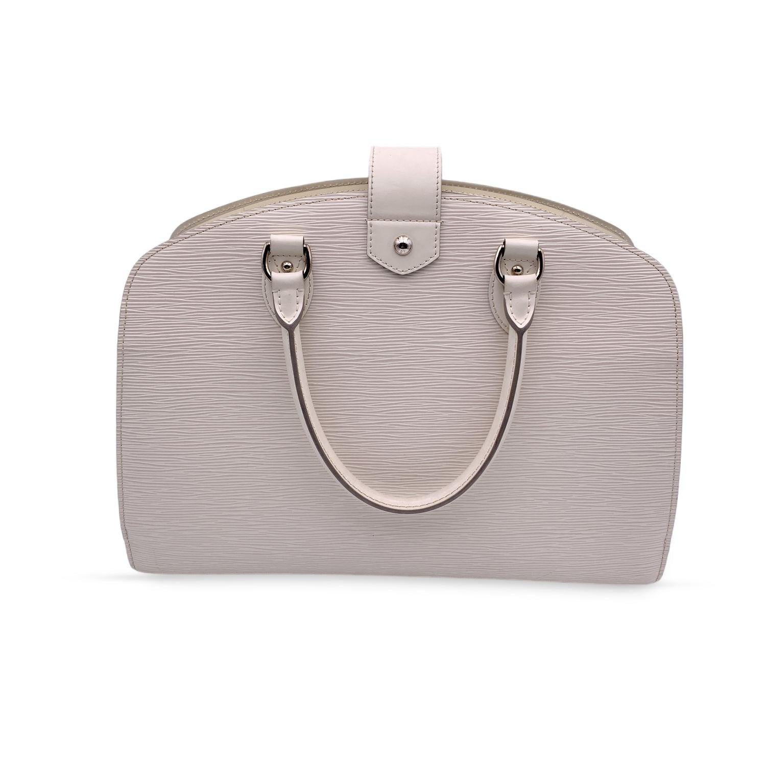 Louis Vuitton Epi Leather Pont-Neuf GM in white Epi leather. Silver-tone hardware. Fold over strap with clac closure and upper zipper closure. Side padlock, with two keys and leather clochette included. Double rolled leather handle. 1 open section