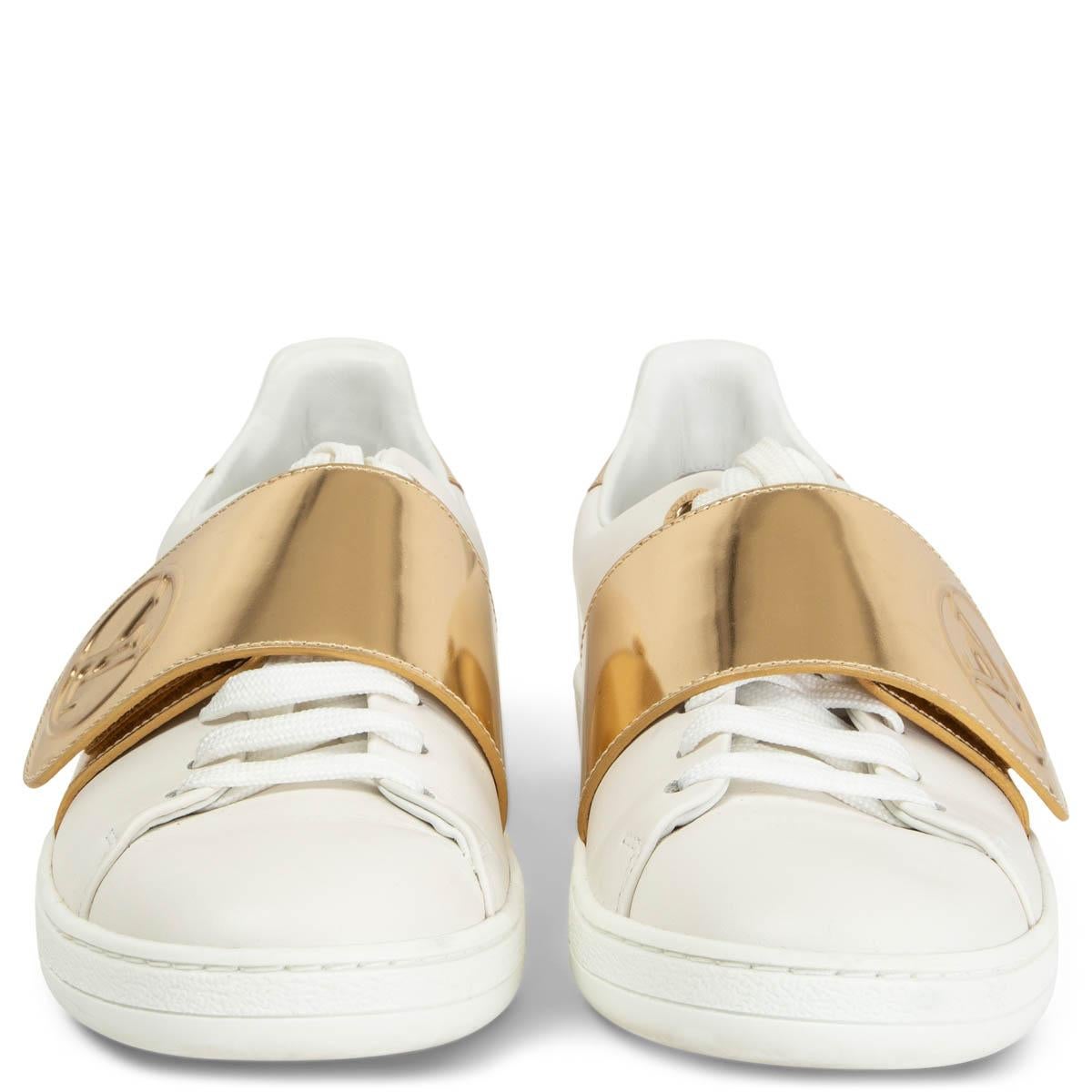 100% authentic Louis Vuitton Low Top Front Row Sneakers in white smooth leather with metallic gold-tone velcro logo closure. Have been worn and are in excellent condition. 

Measurements
Imprinted Size	36
Shoe Size	36
Inside Sole	23cm