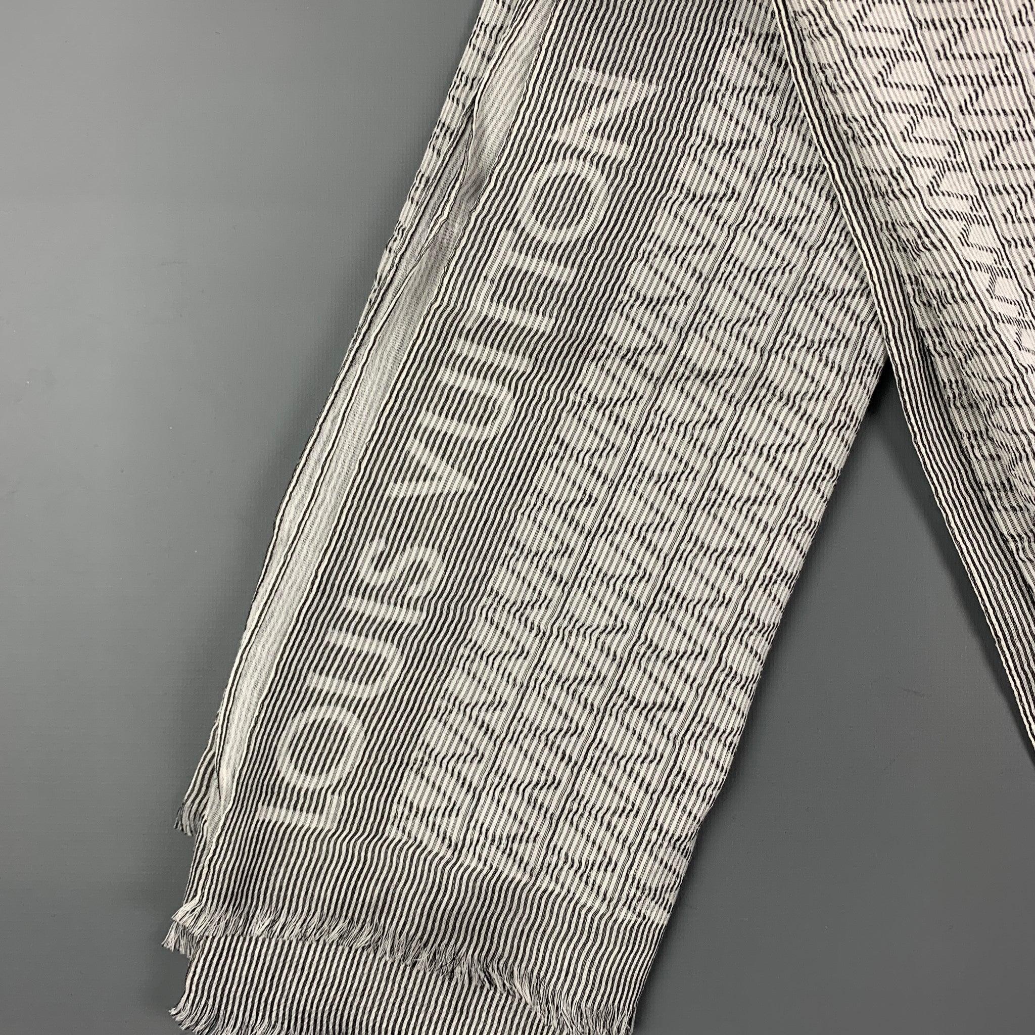 LOUIS VUITTON scarf comes in 
white & grey stripe cotton / silk with a fringe trim. Made in Italy.
Very Good
Pre-Owned Condition. 

Measurements: 
  74 inches  x 27 inches 
  
  
 
Reference: 120137
Category: Scarves
More Details
    
Brand:  LOUIS