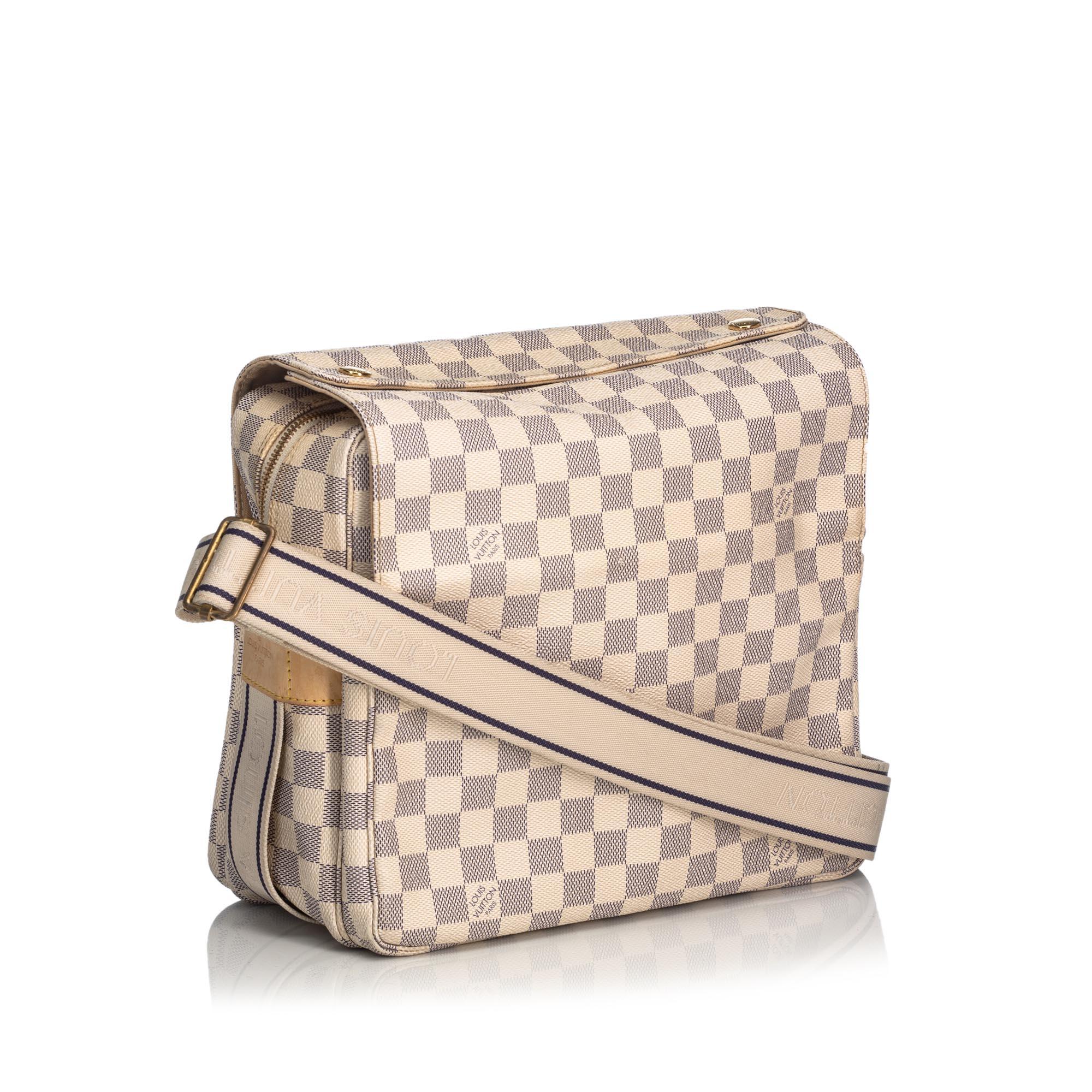 The Naviglio features a damier azur canvas body, flat strap, flap top with snap closure, top zip closure, and interior open pocket. It carries as B+ condition rating.

Inclusions: 
This item does not come with inclusions.


Louis Vuitton pieces do