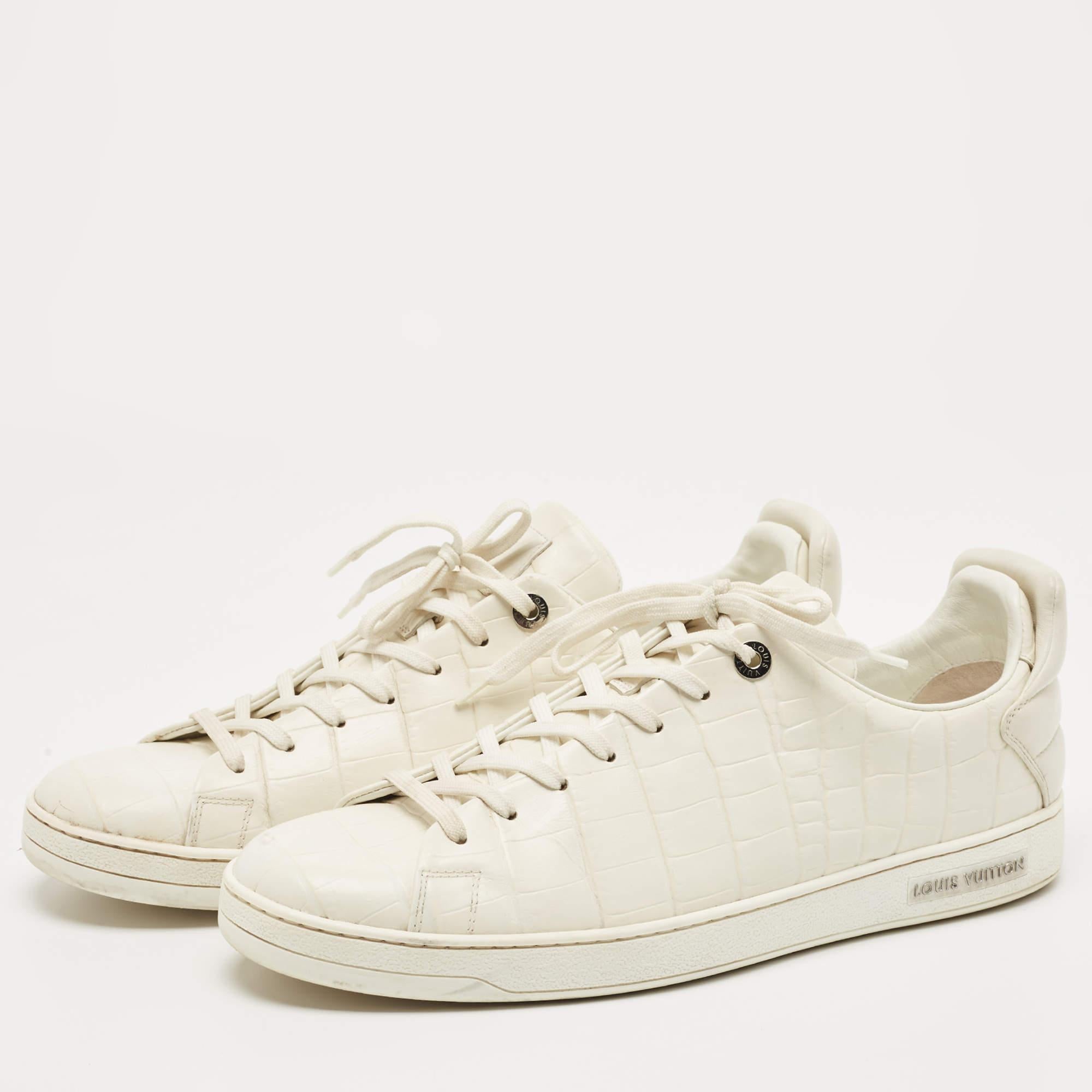 You'll love wearing these Frontrow sneakers from Louis Vuitton! The white sneakers are crafted from croc-embossed leather and feature round toes and lace-ups on the vamps. They come equipped with comfortable leather lined insoles and tough soles.