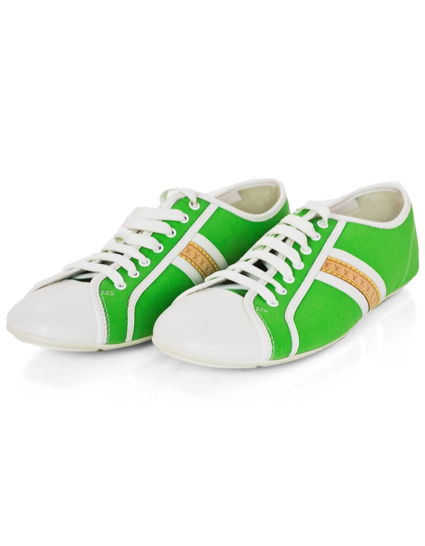 Louis Vuitton White Leather & Green Canvas Sneakers Sz 38 NEW

Color: White, Green
Closure/Opening: Lace tie closure
Sole Stamp: LV 
Overall Condition: Excellent pre-owned condition - NEW
Marked Size: 38
Heel Height: .25