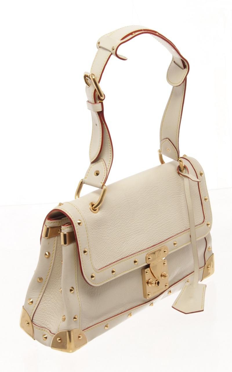 Louis Vuitton White Leather Le Talentueux Shoulder Bag with shoulder strap, polished brass hardware including corner plates and gold-toned pyramid studs. The front flap opens to a white Louis Vuitton monogram logo fabric interior with a patch