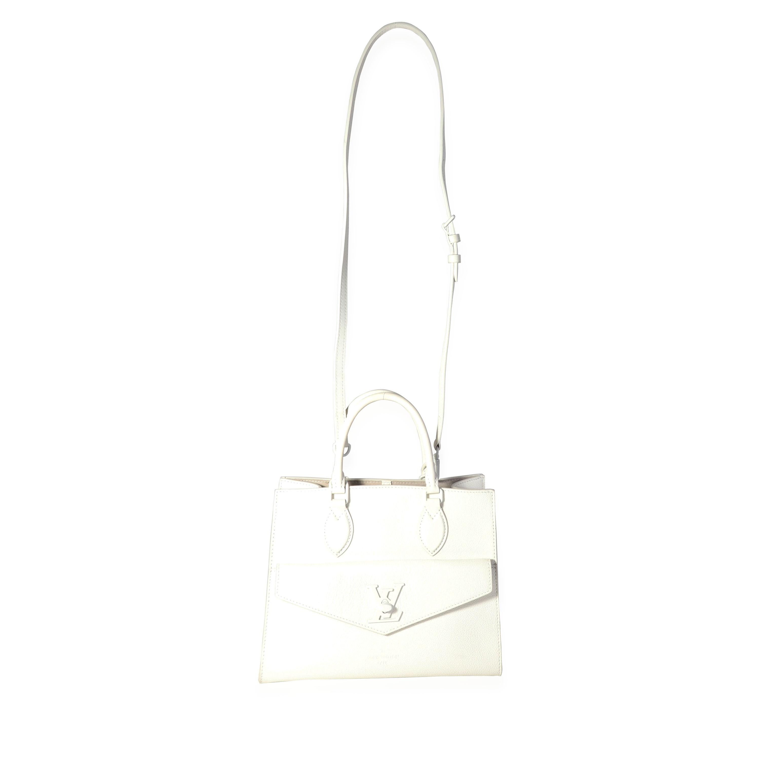 Listing Title: Louis Vuitton White Leather Monochrome Lockme Tote PM
SKU: 118430
MSRP: 3400.00
Condition: Pre-owned (3000)
Handbag Condition: Excellent
Condition Comments: Excellent Condition. Faint wear to corners. No other visible signs of