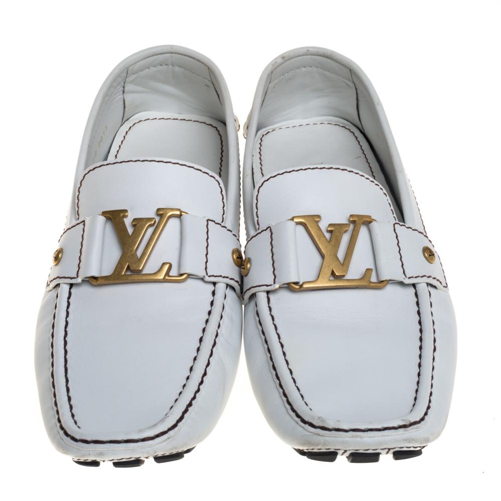 Look sharp and neat with this pair of Monte Carlo loafers from Louis Vuitton. They have been crafted from white leather and designed with the art of fine stitching and the signature 'LV' on the uppers. The pair is complete with comfortable insoles