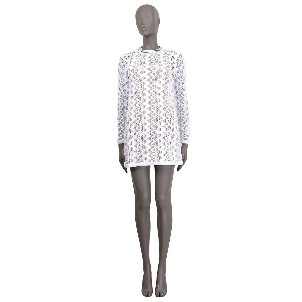 100% authentic Louis Vuitton long sleeve tribal pattern knitted dress in white polypropylene (100%) with a black and white leather crew neck. Comes with a slip in nude silk (91%) and elastane 9%). Other fabrics are white cotton (57%) and polyester