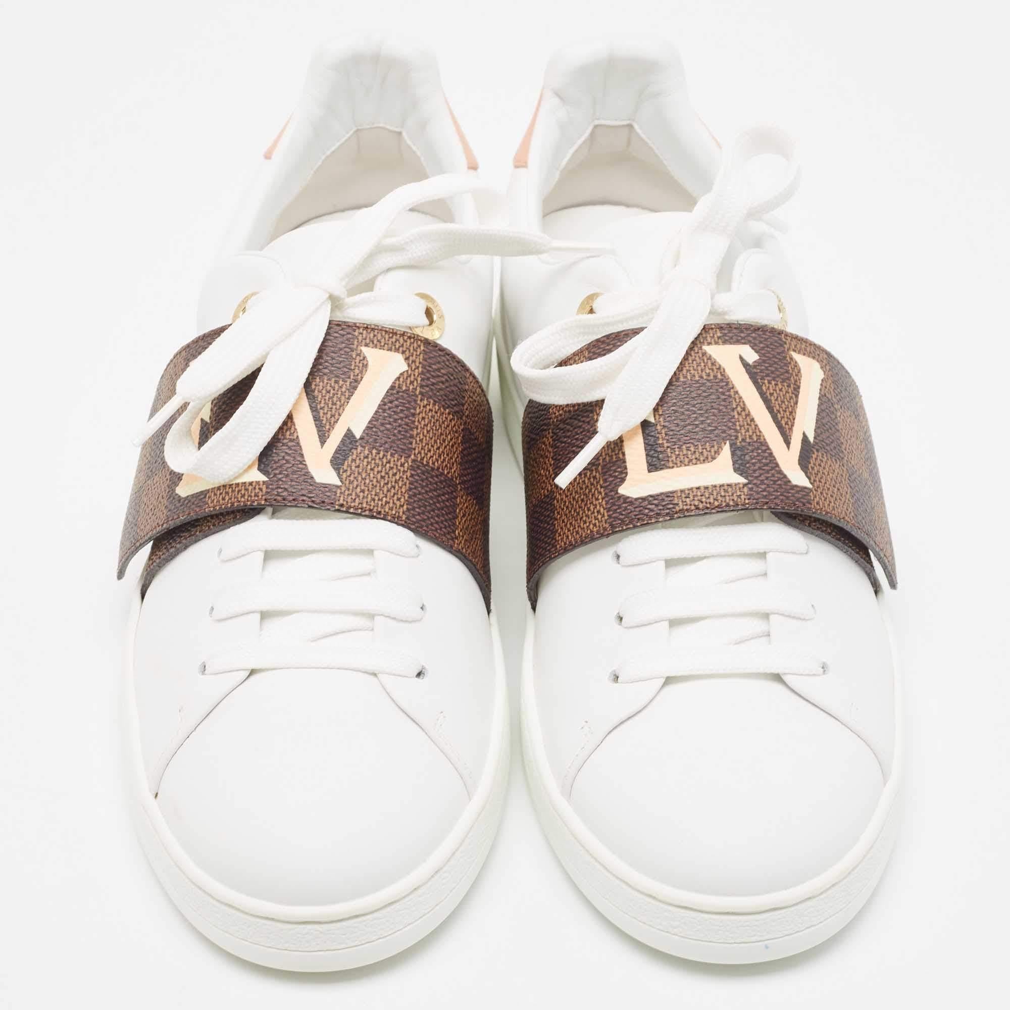 A great way to elevate your casual look, these white sneakers from Louis Vuitton feature a contrasting velcro strap over the lace-up vamps. The brand name vamps adds a luxe touch to the design.

Includes
Original Dustbag, Lace