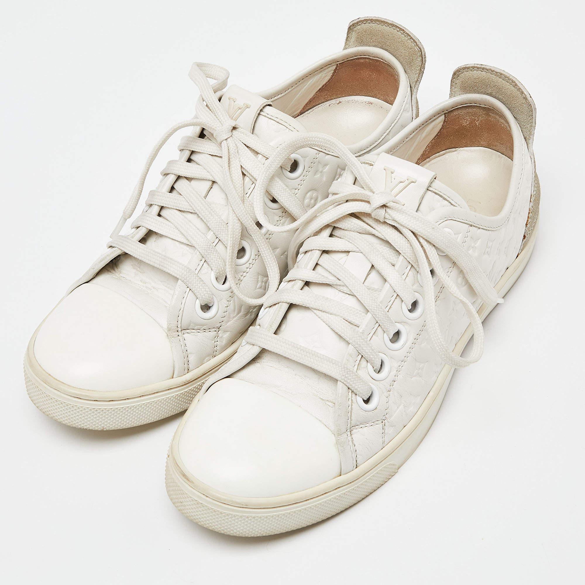 Don't miss out on making these classy sneakers yours this season. Crafted from Monogram leather and suede, these white sneakers feature lace-up vamps, rubber soles, and leather insoles for added comfort. These trendy and chic sneakers from Louis