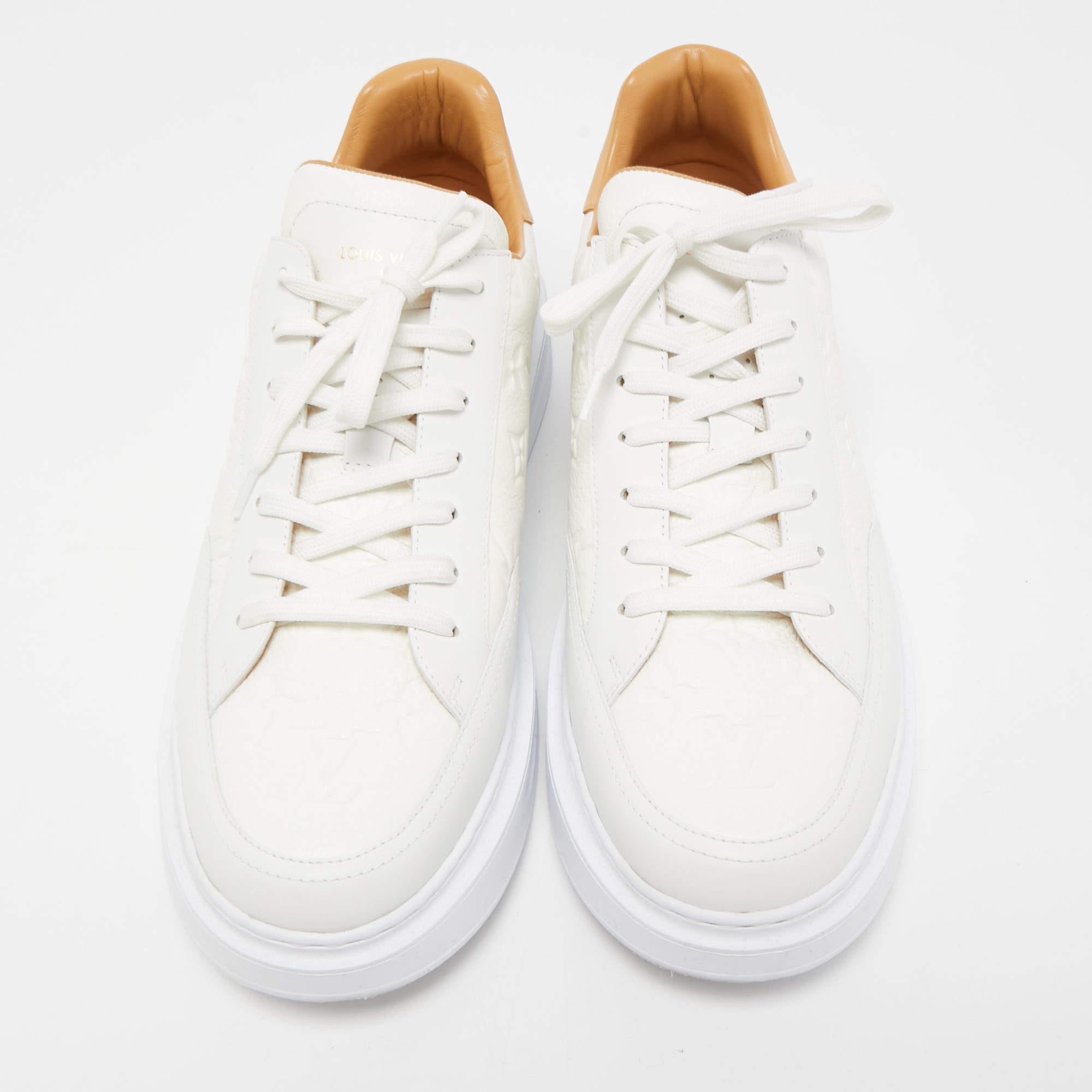 Packed with style and comfort, these Louis Vuitton Beverly Hills white sneakers are gentle on the feet so that you can glide through the day. They have a sleek upper with lace closure, and they're set on durable rubber soles.

