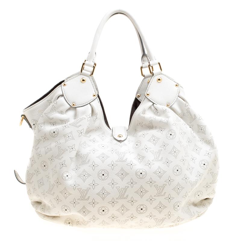 Louis Vuitton handbags are a symbol of luxury and class and owning one is a guarantee of high-end fashion. A highly sought-after design from the label, inspired by the phases of the moon, this Mahina XL bag is statement creation that a fashionista
