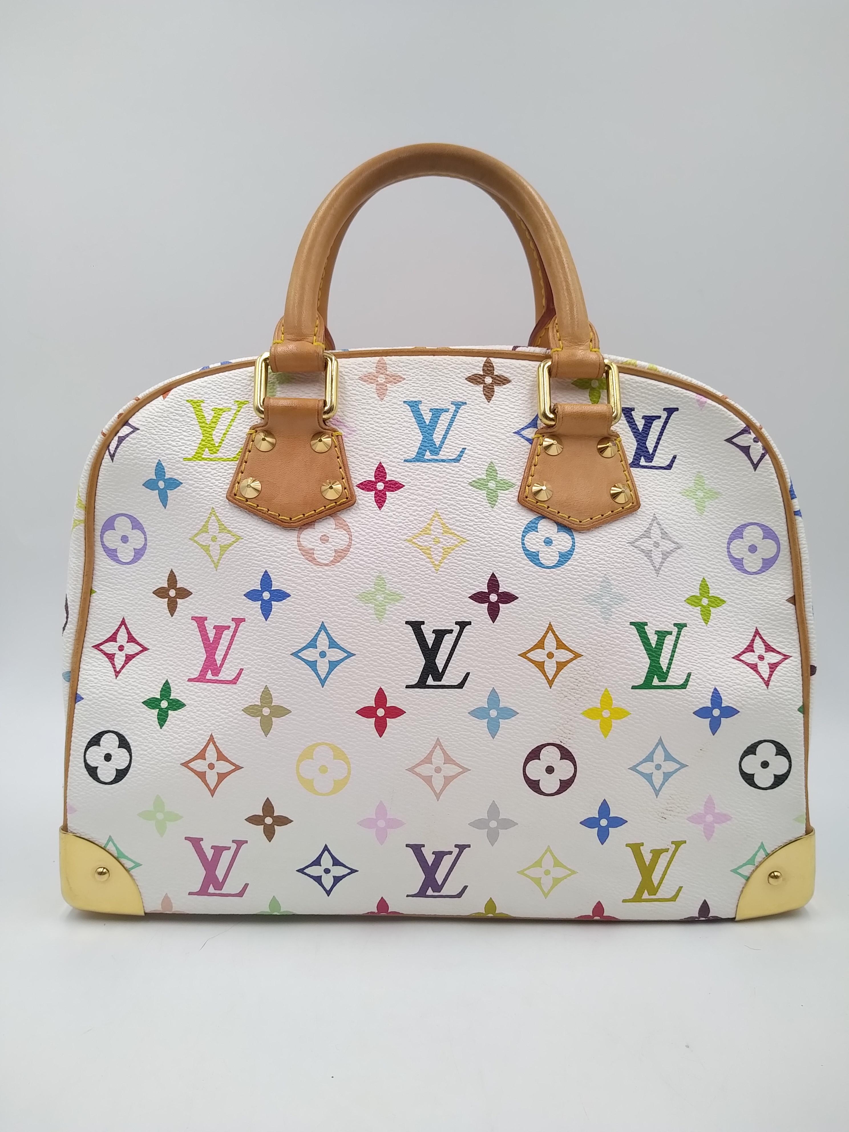 Louis Vuitton White Monogram Multicolor Trouville Bag, 2004.
The Louis Vuitton Monogram Multicolore collection is relatively new and was first introduced in spring 2003. Takashi Murakami decided to revamp the traditional monogram toile and give it a