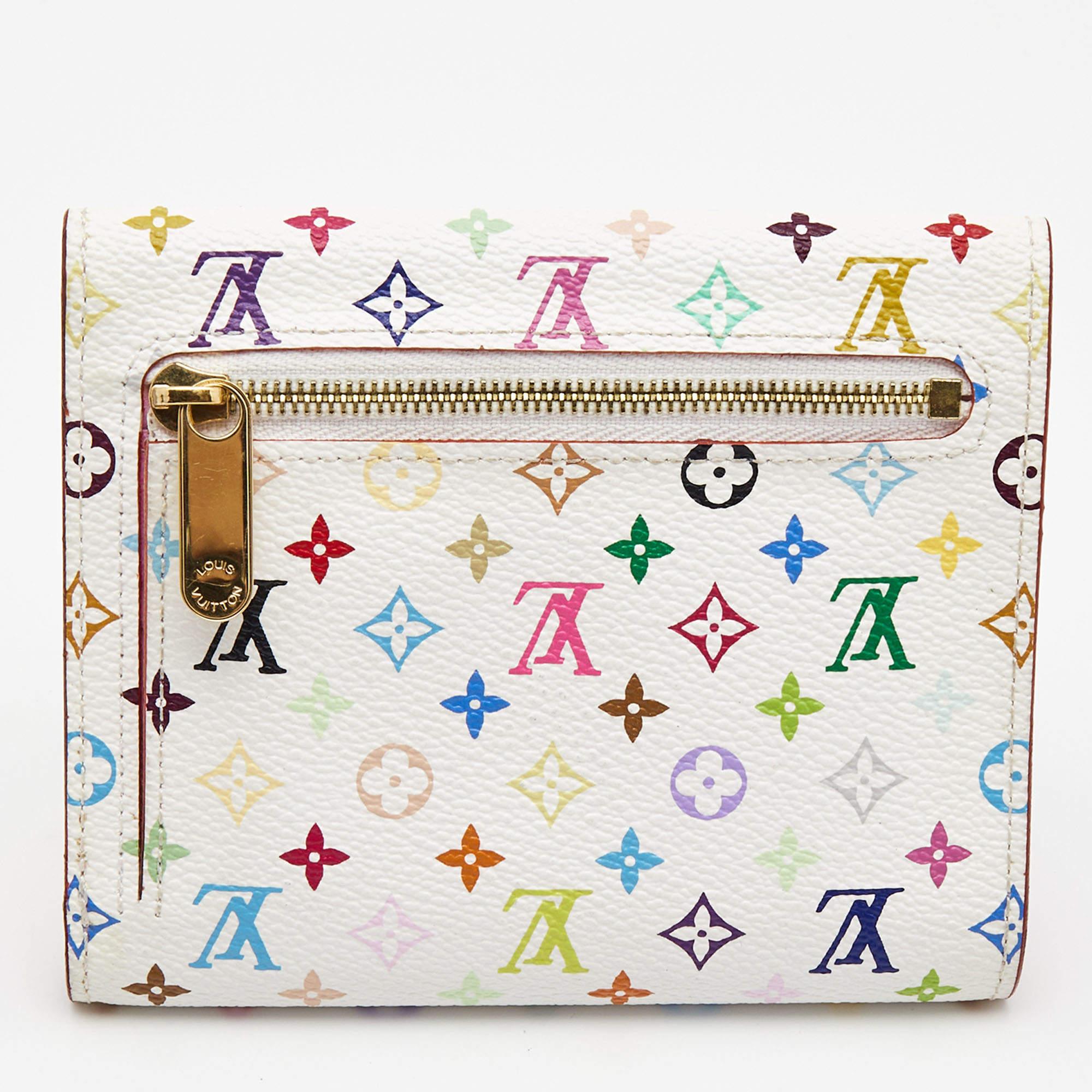 Take this chic and functional wallet by Louis Vuitton everywhere. Made from signature Multicolore Monogram canvas, this Joey wallet is accented with a gold-tone closure in the front. The easy to organize interior is lined with leather and features