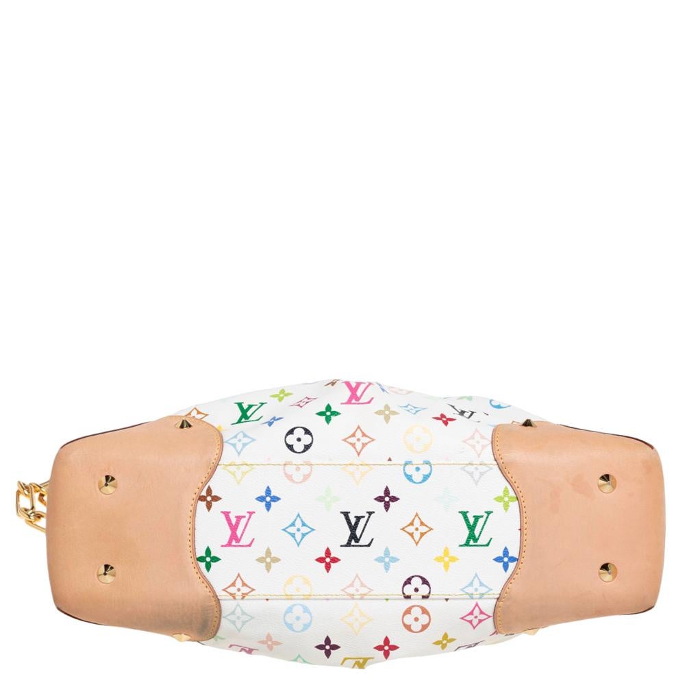 Crafted from their signature Multicolore Monogram canvas, this white Louis Vuitton bag features a detachable chain handle and frame handles engraved with the brand label. While the gold-tone hardware elevates its beauty, the Alcantara-lined interior