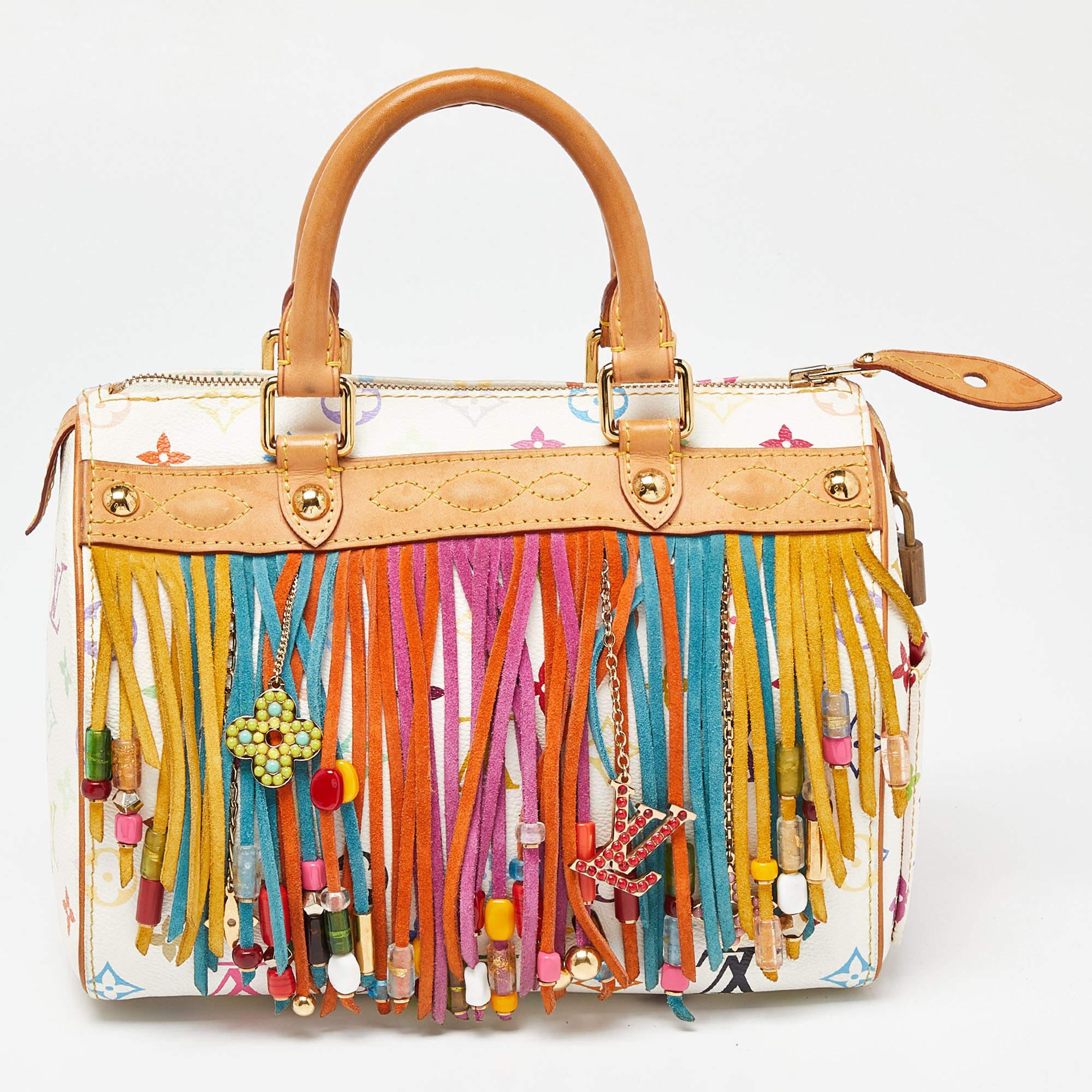 A limited edition bag from LV, this Fringe Speedy 25 is vibrant and features plenty of color drama. The body features a colorful Monogram Multicolore canvas exterior and the cheerful piece is accessorized with gorgeous multi-hued beads and monogram