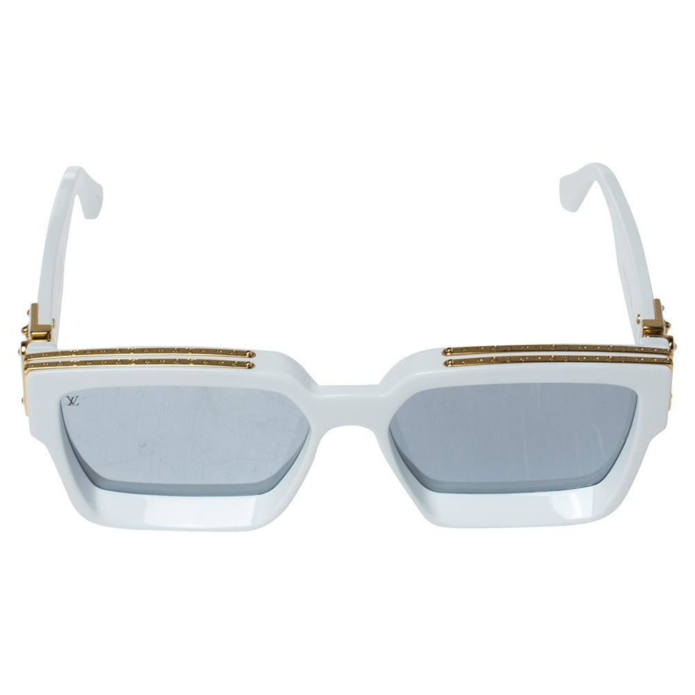 These 1.1 Millionaires sunglasses essay eyewear fashion at its best. The pair comes in a square acetate frame with a deep beveled front and full silver lenses. Highlighting the creation are details such as the gold-tone monogram trim and the