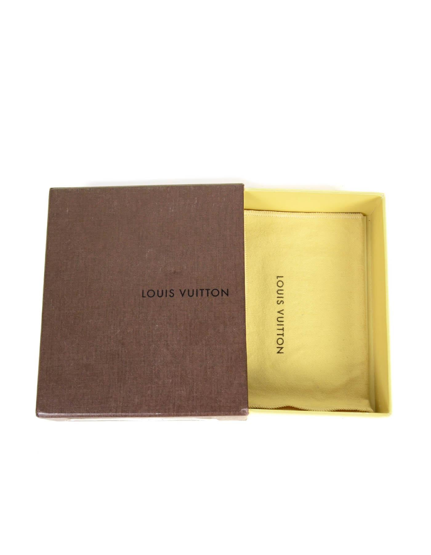 Louis Vuitton White Multicolor Monogram Card Holder

Made In: Spain
Year of Production: 2008
Color: White and multicolor
Hardware: Goldtone
Materials: Coated canvas
Lining:
Closure/Opening: Flap top with snap
Exterior Pockets: Back slit
Interior