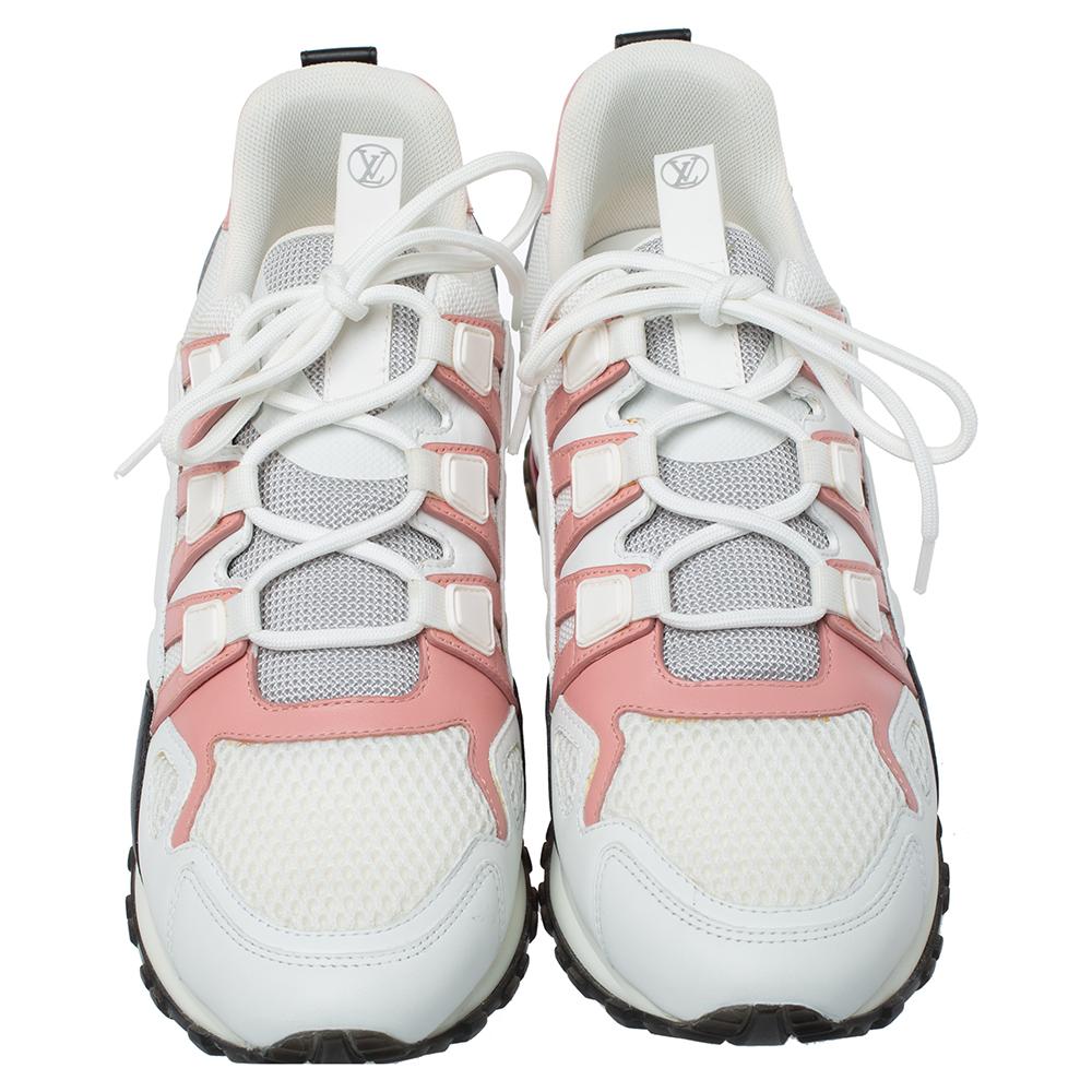 Made to provide comfort, these Run Away sneakers by Louis Vuitton are trendy and stylish. They've been crafted from mesh, leather, nylon and designed with lace-up vamps and the label's logo on the side panels and the heel counters. Wear them with