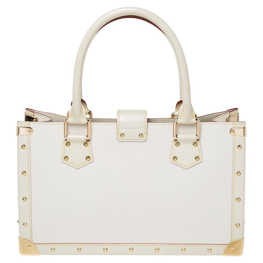 This Le Fabuleux bag from Louis Vuitton is a stunning creation that features a structured yet elegant shape. It is made in France from the finest Suhali leather and impeccably crafted to create a modern style. The gold-tone hardware detailed studs