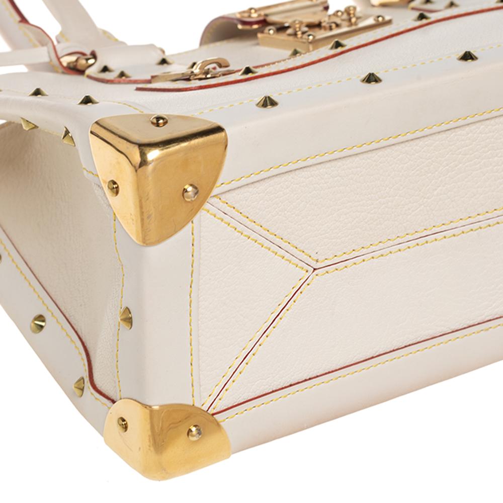 This Le Fabuleux bag from Louis Vuitton is a stunning creation that features a structured yet elegant shape. It is made in France from the finest Suhali leather and impeccably crafted to create a modern style. The gold-tone studs and corners
