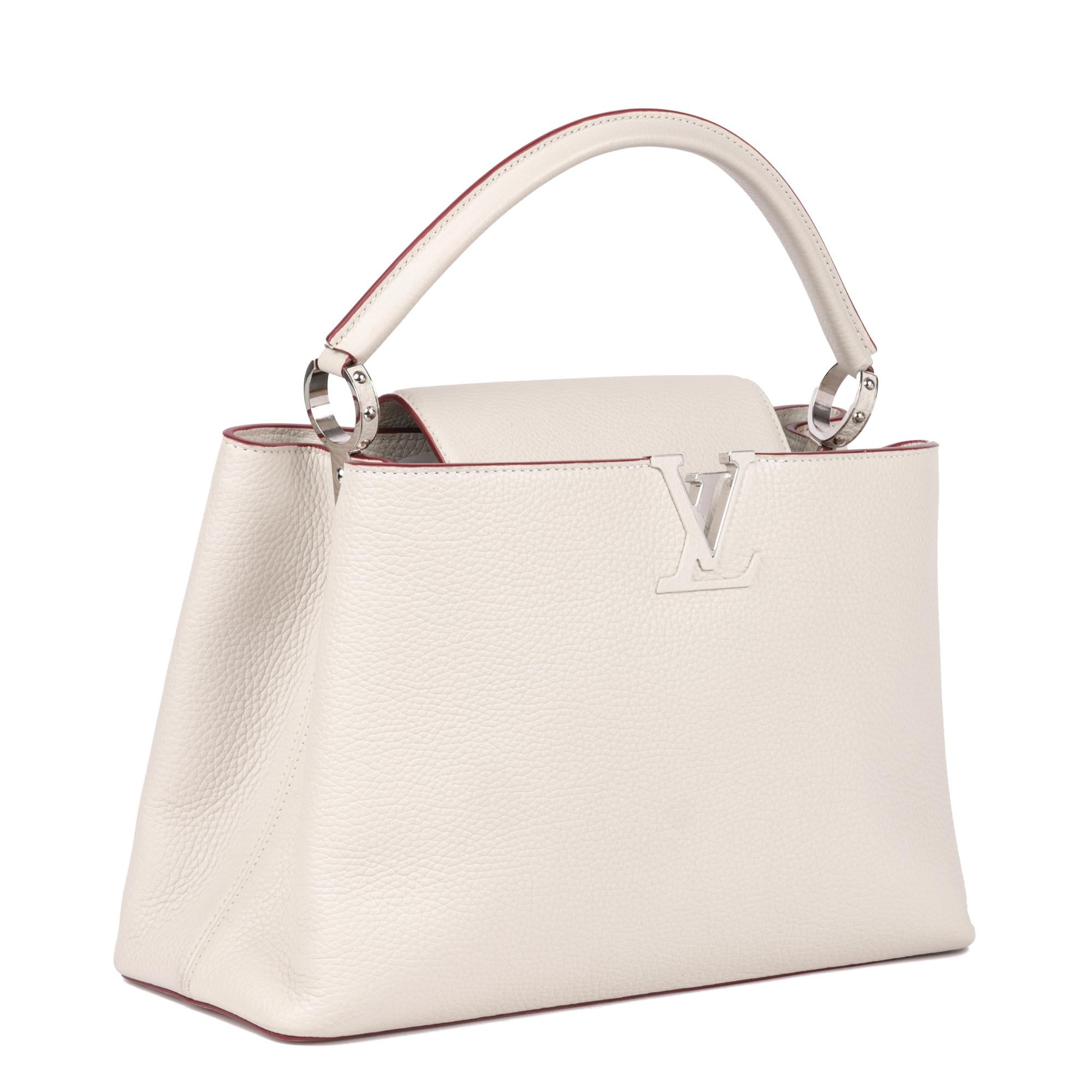 LOUIS VUITTON
White Taurillon Leather Capucines MM

Xupes Reference: CB842
Serial Number: TR2103
Age (Circa): 2013
Accompanied By: Louis Vuitton Dust Bag, Louis Vuitton Repair Card
Authenticity Details: Date Stamp (Made in France)
Gender:
