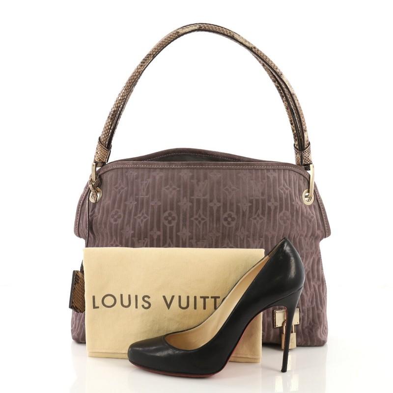 This Louis Vuitton Wish Bag Monogram Suede with Python, crafted from purple monogram suede with genuine brown python, features a single looped top handle, decorative padlock, and gold-tone hardware. It opens to a gray leather interior with zip