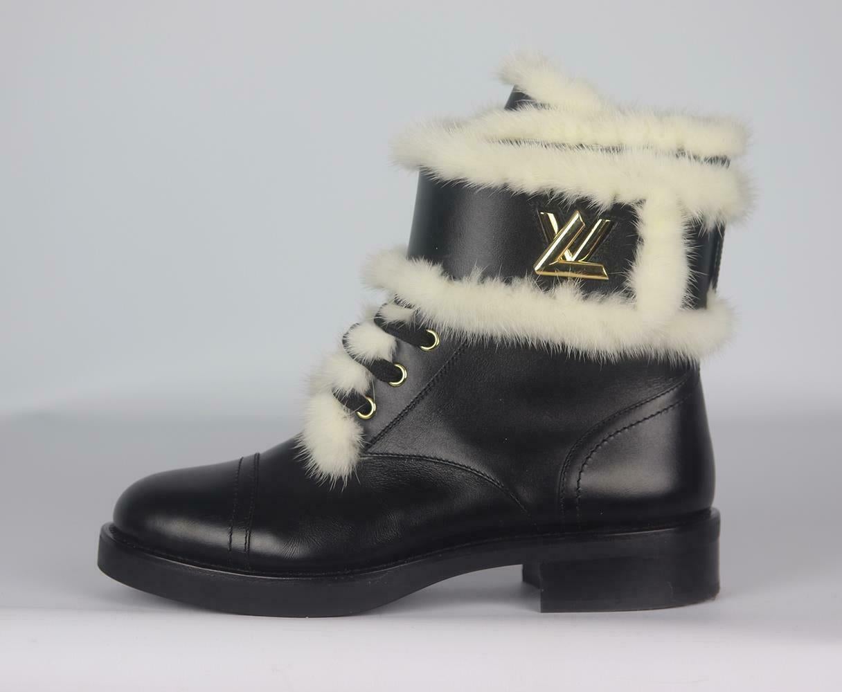 The perfect addition to your chic outfits, Louis Vuitton's 'Wonderland' boots are made from panels of leather and lined in shearling fur, and trimmed in luxurious mink-fur and finished with the LV gold twist lock.
Rubber sole measures approximately