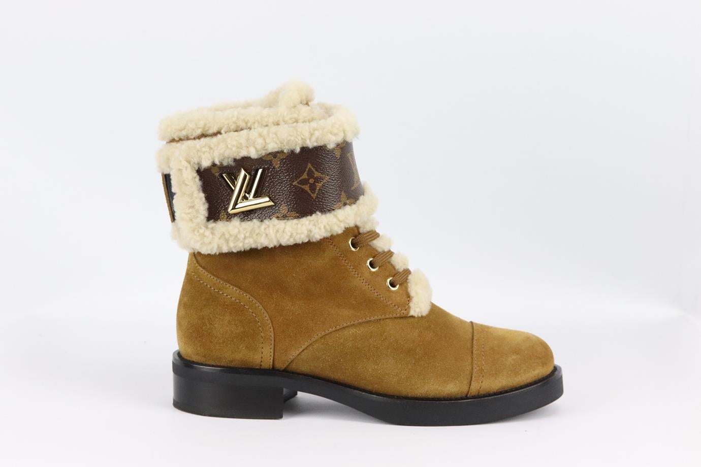 Louis Vuitton Wonderland shearling lined suede ankle boots. Brown and tan. Lace up fastening at front. Does not come with box or dustbag. Size: EU 38 (UK 5, US 8). Outersole: 10.2 in. Shaft: 6 in. Heel: 1.2 in. Very good condition - Worn once. Light