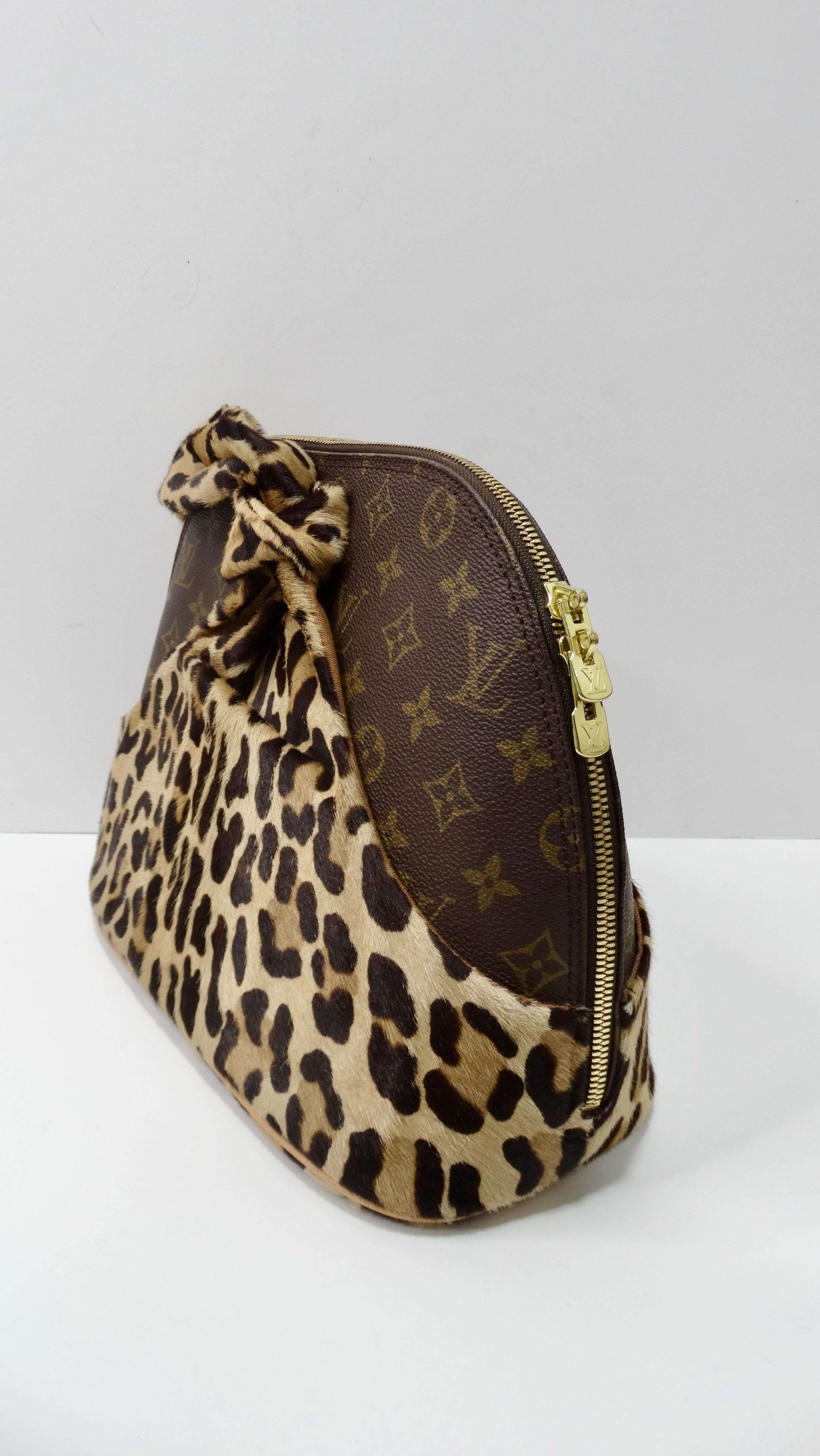 Complete your bag collection with this amazing Louis Vuitton x Azzedine Alaia Leopard Alma! Circa 1996, this limited edition collaboration from the 'Centenaire' 100th Anniversary Collection features the iconic Louis Vuitton Alma bag encased in