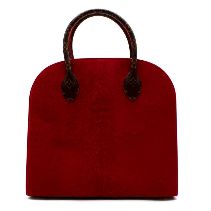 Louis Vuitton Monogram Calf Hair Studded Iconoclast Red Tote By Christian Louboutin Collaboration

- Studded detailing around the front of the bag in gold
- Red Calf hair on the other side of the bag
- Monogram print on the base and handles with red