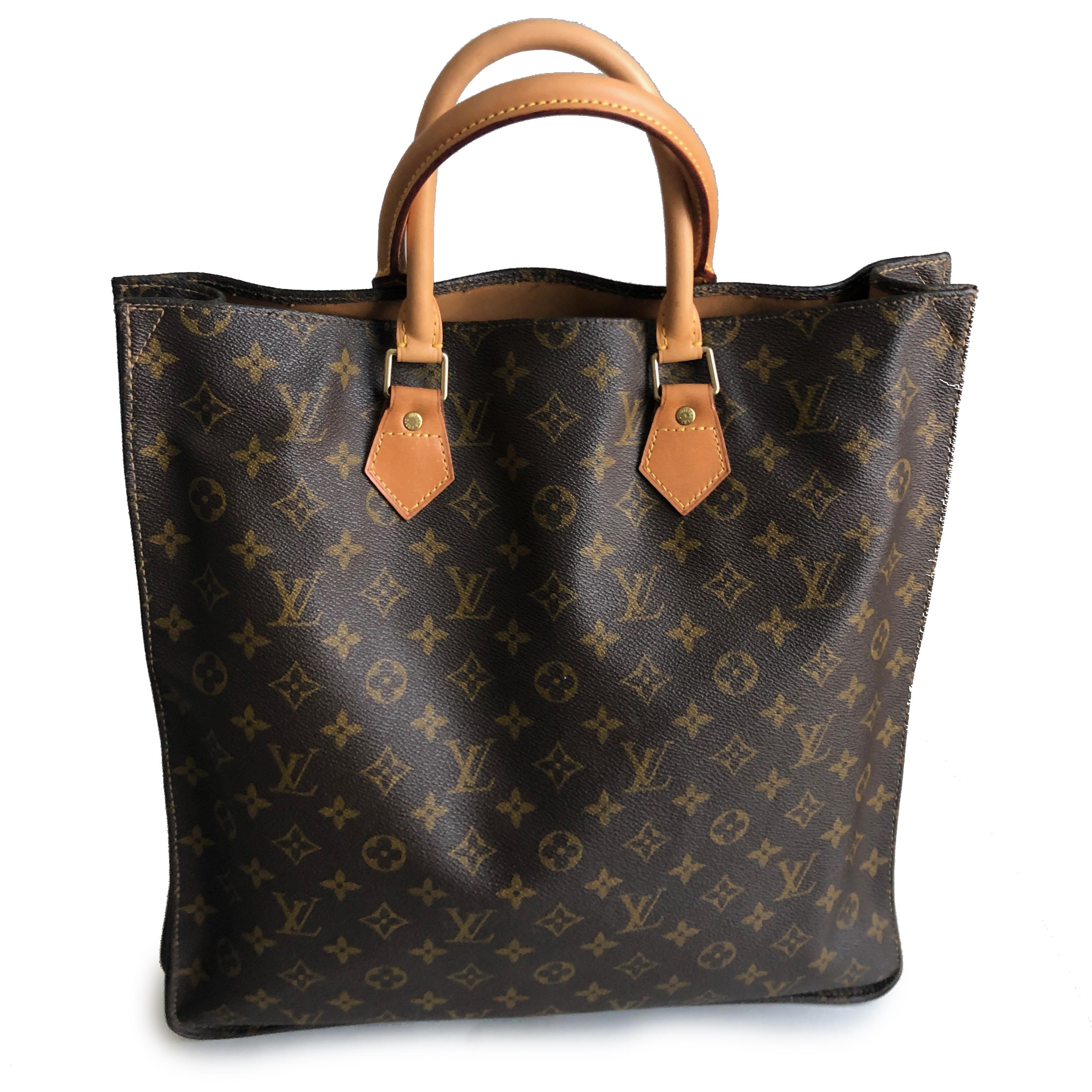 Authentic, preowned, vintage Louis Vuitton x French Company Sac Plat Tote Bag in monogram canvas w/vachetta leather handles. Fully-lined in brown fabric, with no interior pockets. 15in H x 14in L x 4in D with 5in handle drop. Preowned/vintage with