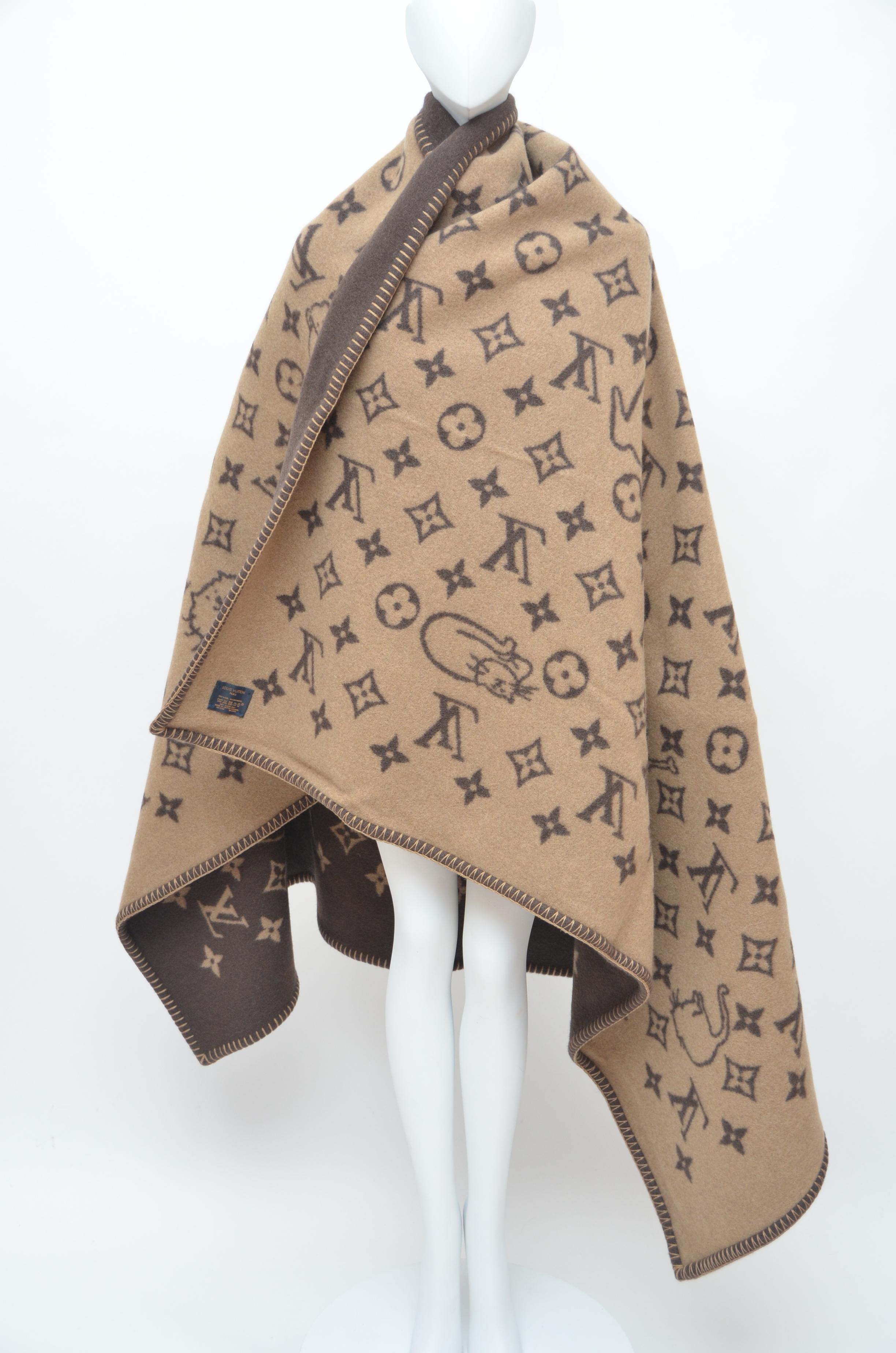 Big blanket/scarf with Monogram print, Louis Vuitton; black hat