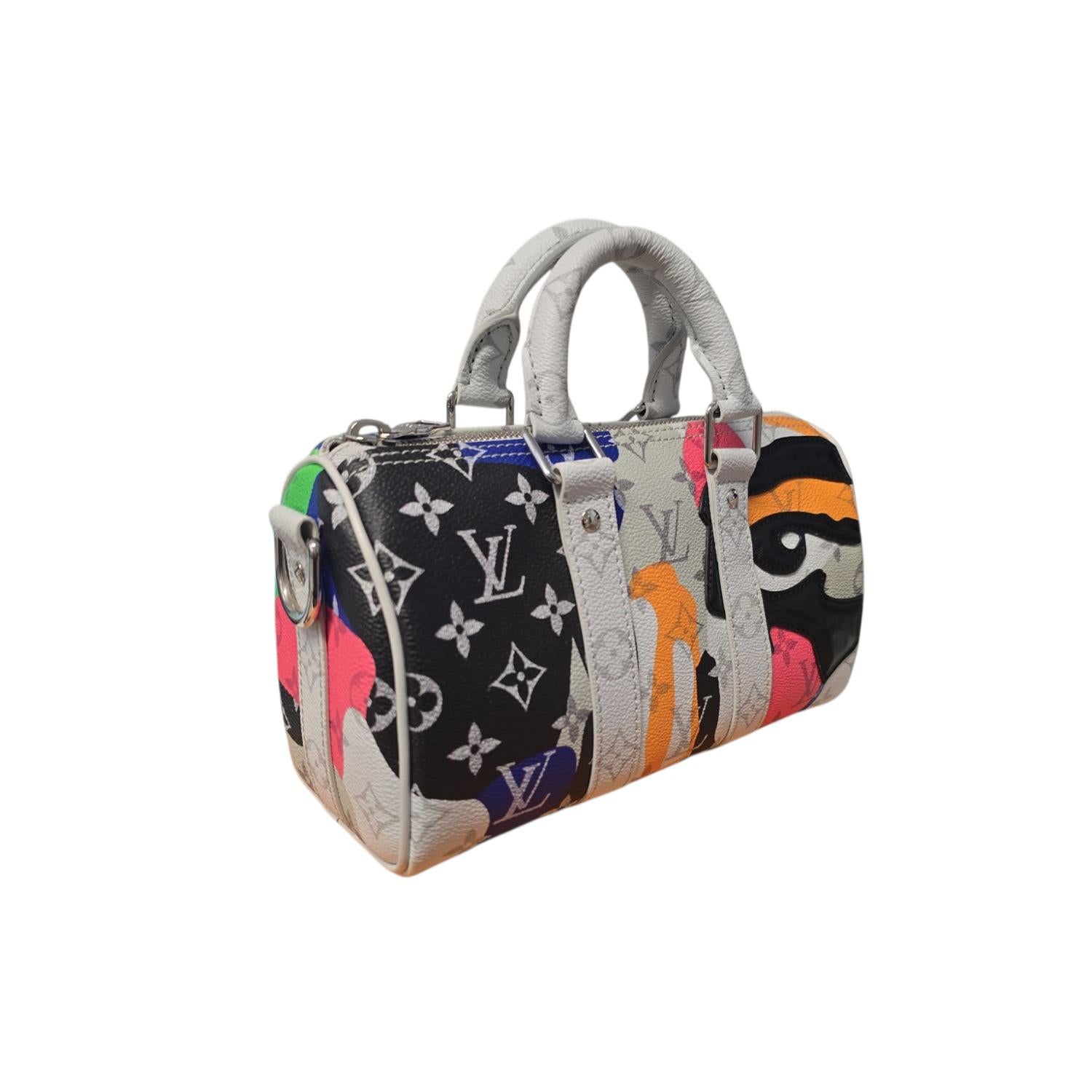 The Louis Vuitton Monogram X KidSuper Multicolor Portrait Keepall Bandouliere 25 from the 2023 Pharrell Williams collection combines iconic craftsmanship with contemporary artistry. Crafted from multicolor Monogram coated canvas and cowhide leather,