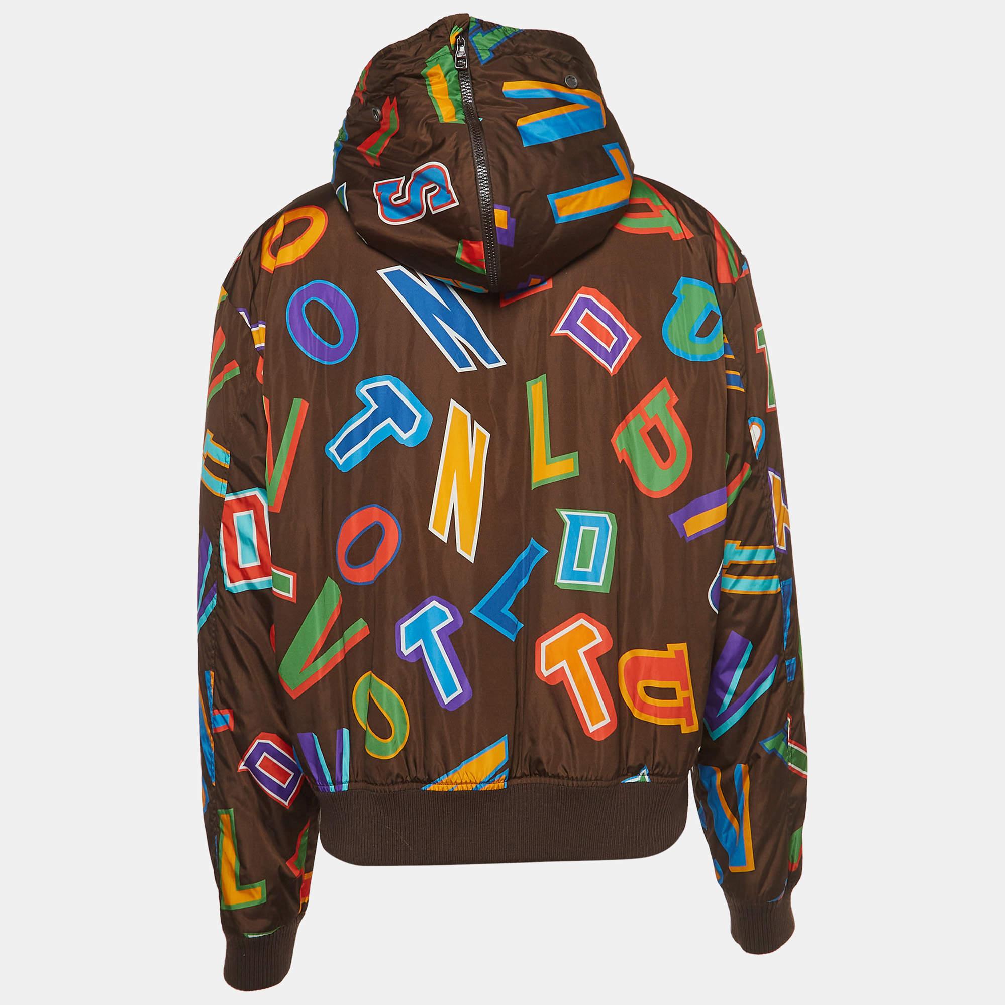 The Louis Vuitton X NBA jacket is a vibrant and stylish outerwear piece. Crafted from high-quality nylon, it features a dynamic print of multicolored letters, combining luxury fashion with the energetic aesthetic of the NBA. The hooded design adds a