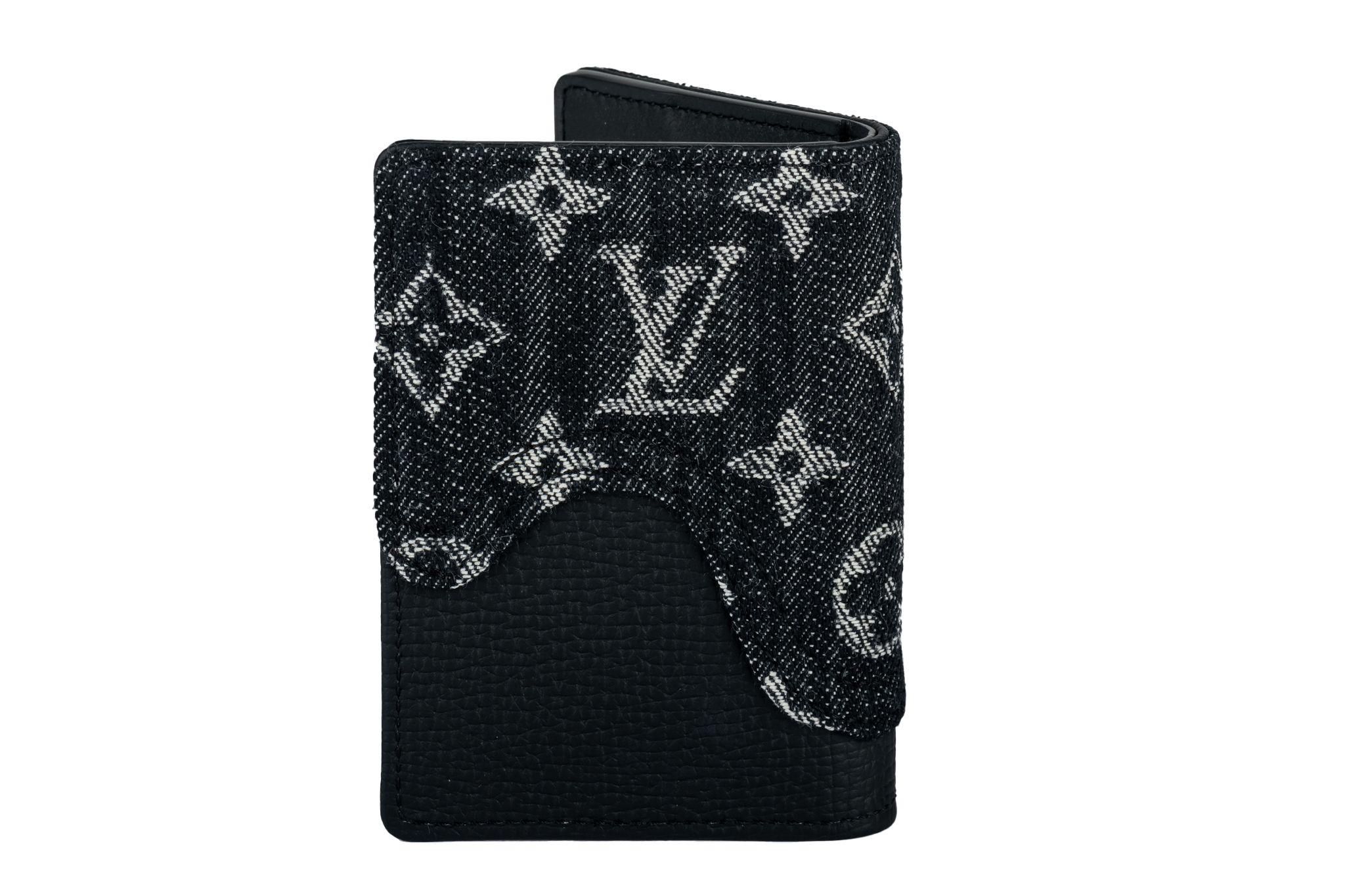 Louis Vuitton Virgil Abloh x NIGO Black Monogram Denim Drip and Taurillon Pocket Organizer from 2021. This piece is lined with black leather and was featured during the collaboration with Japanese artist NIGO. It has multiple compartments and a