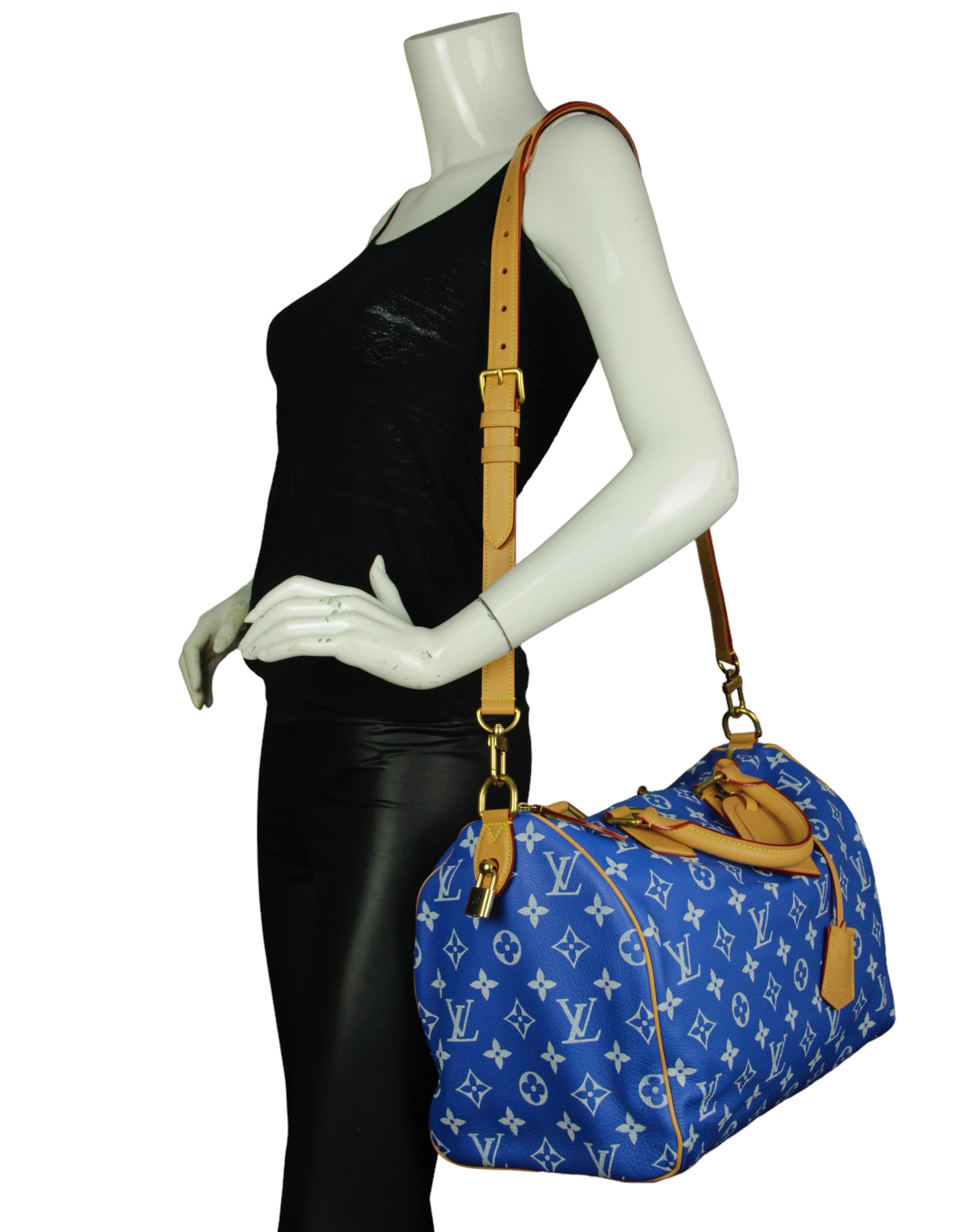 Louis Vuitton Limited Edition Blue Soft Calfskin Monogram Speedy P9 Bandouliere 40. Features removable luggage tag, clochette, crossbody/shoulder strap and pouch. 

Made In: France
Color: Blue
Hardware: Goldtone hardware
Materials: Calfskin