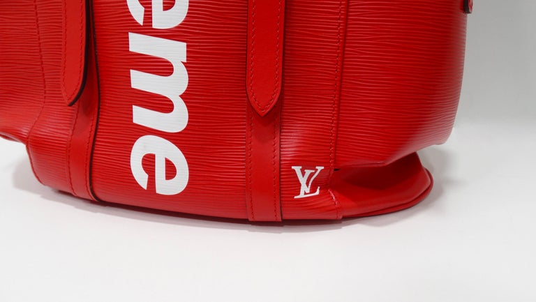 Elevate every look with this red hot LV x Supreme backpack! Dropped in 2017 at LV's Fall menswear show, the Louis Vuitton x Supreme Christopher backpack is a structured bag with killer style. Crafted from durable cherry red Epi leather with the