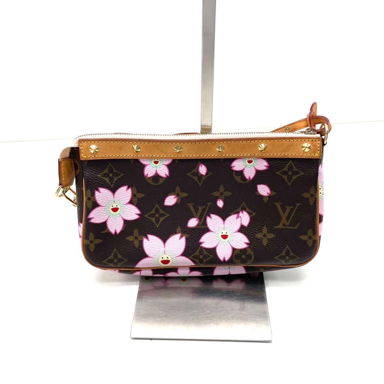 Louis Vuitton x Takashi Murakami Cherry Blossom on Brown Monogram Pochette Accessoire
 These are professional photos of the actual bag .
 The Pochette Accessoire Bag is one of the most iconic design by the French fashion house, Louis Vuitton in