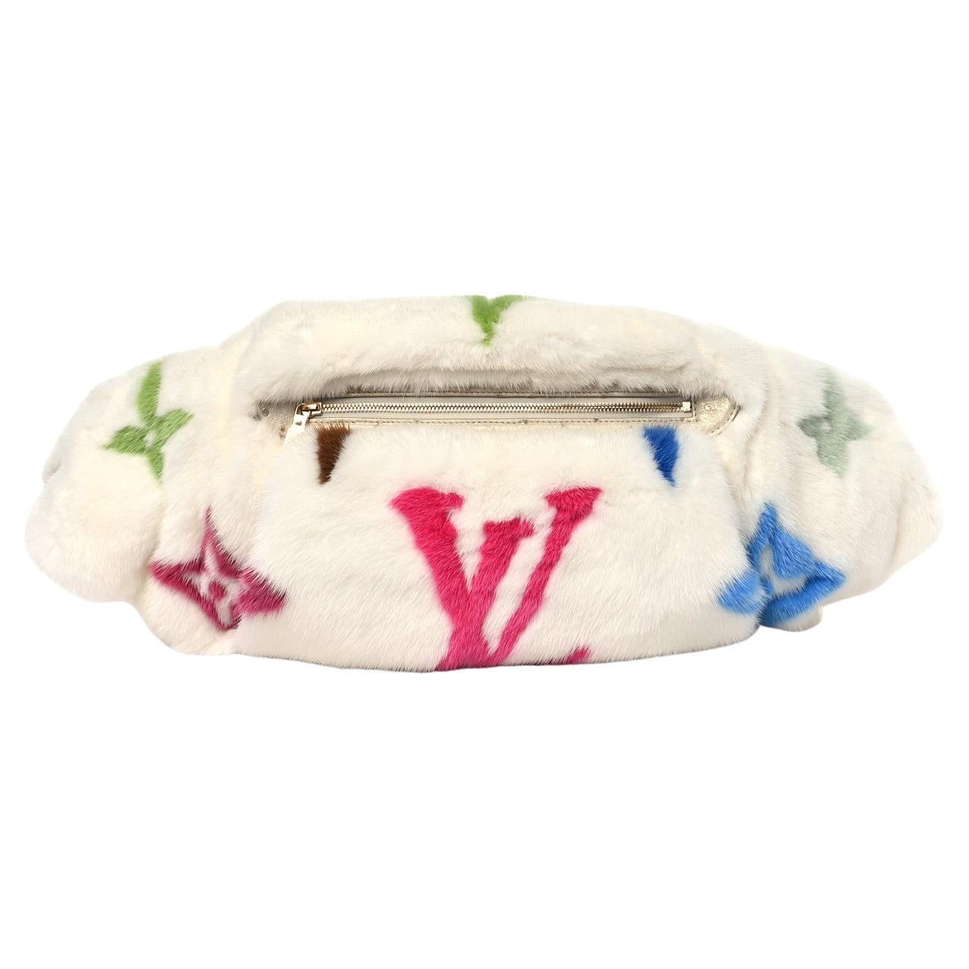 A rare and luxurious piece from the Louis Vuitton x Takashi Murakami collaboration, this multicolor monogram bum bag is a true collector’s item. Crafted from sumptuous mink fur with Murakami’s signature vibrant monogram print, this re-edition