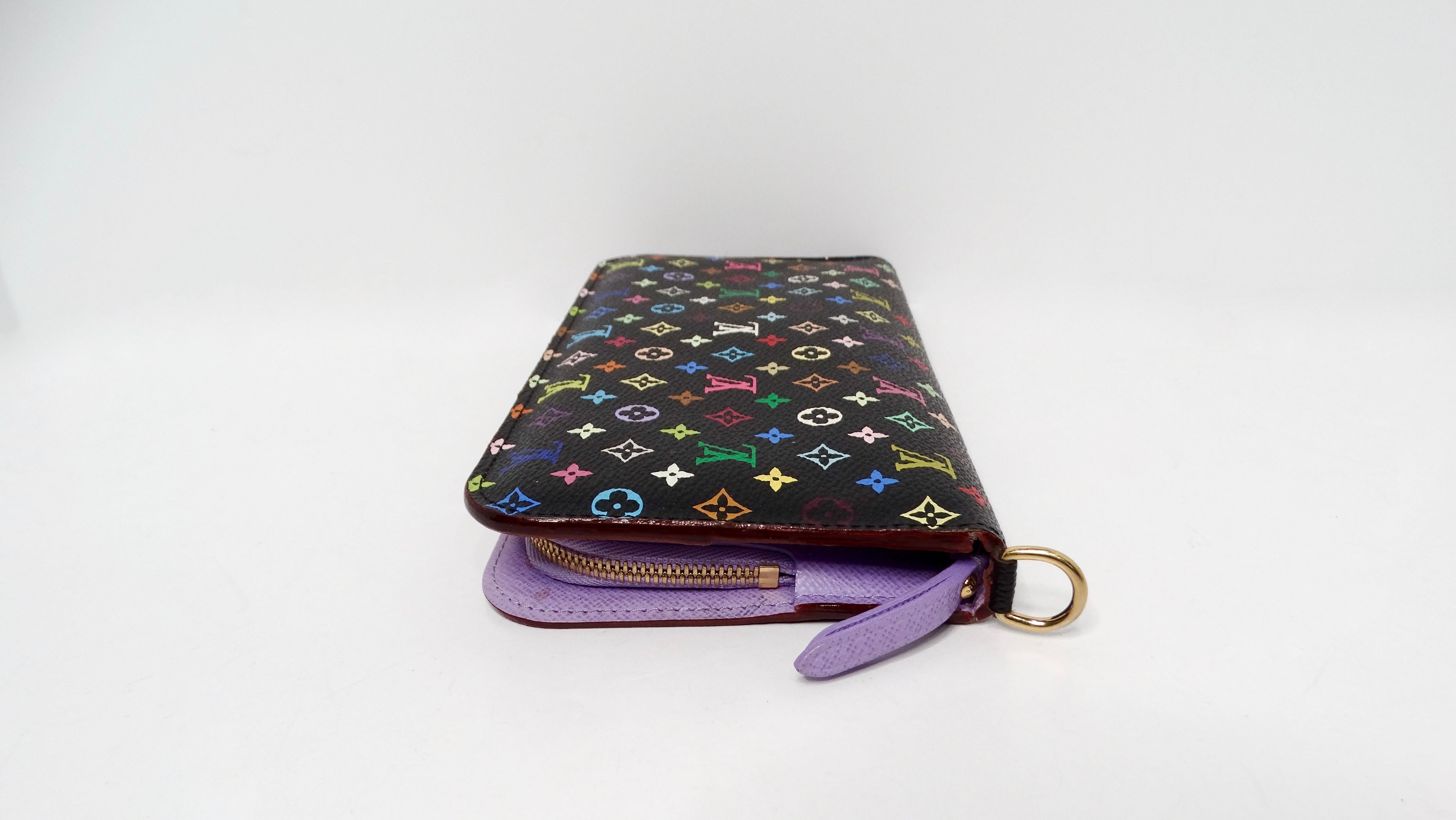 The Louis Vuitton x Takashi Murakami Y2K Black Monogram Multicolor Insolite Wallet is a stunning fusion of luxury, artistry, and functionality. Crafted from black canvas leather, this long wallet showcases a vibrant multicolor monogram design that