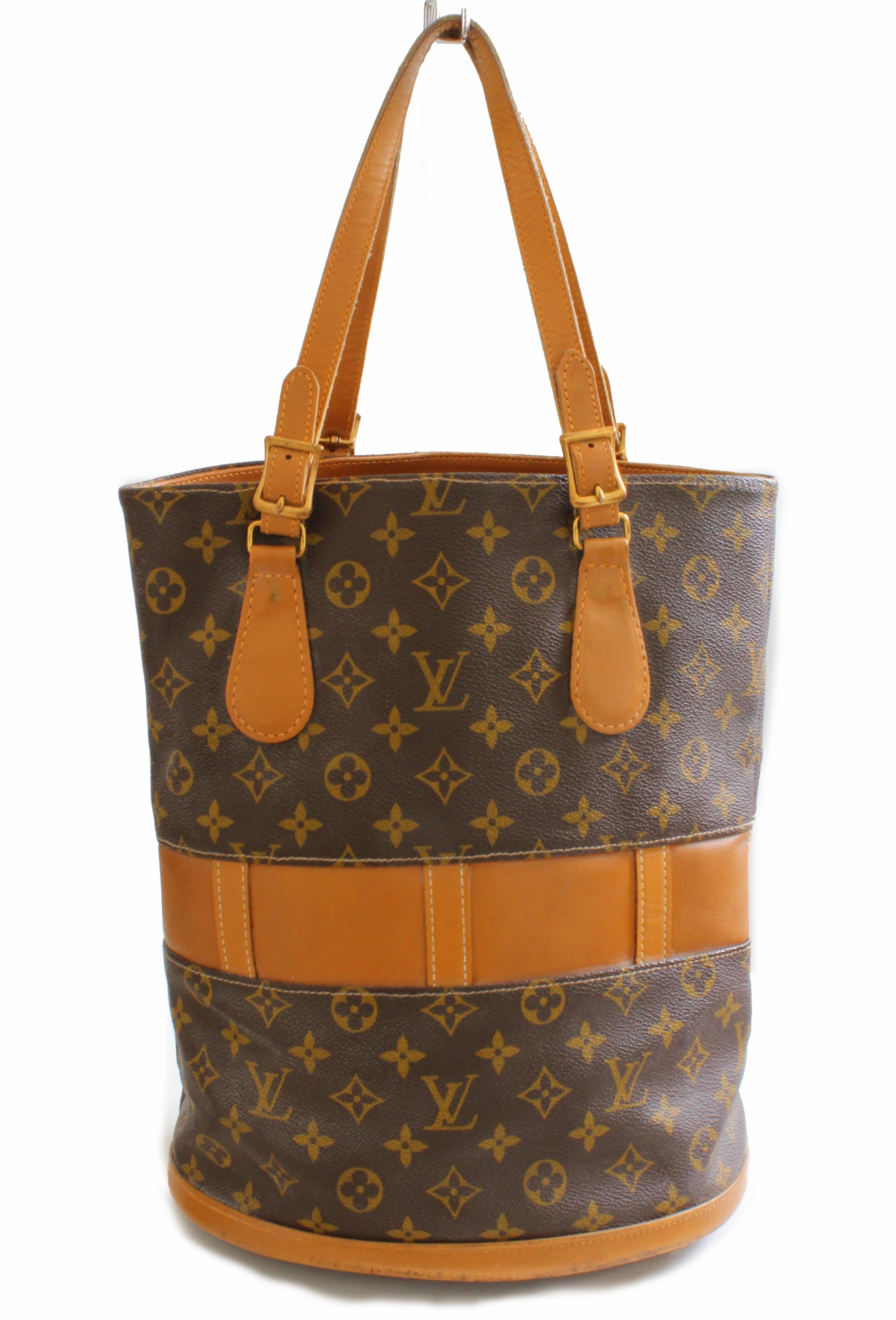 This unique monogram canvas and leather bucket bag was made for Louis Vuitton by The French Company under special license, most likely in the mid 1970s.  Produced for only a short period, these incredible French Company pieces were manufactured long