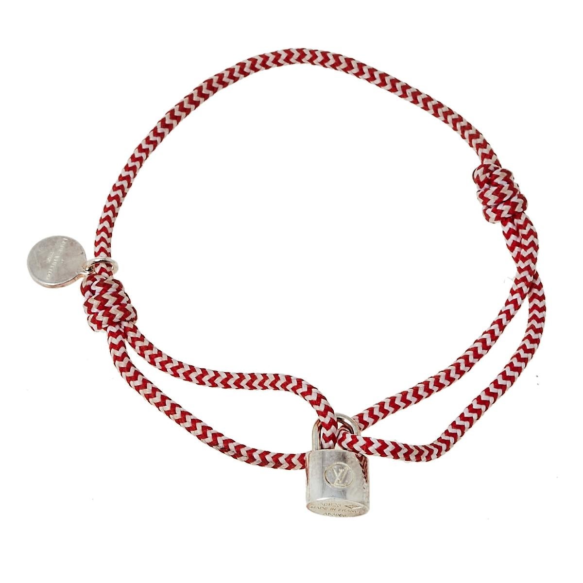 This Louis Vuitton for UNICEF collection is a beautiful celebration of childhood. This bracelet from the line has a cord that holds the LV logo engraved padlock smoothly sculpted from sterling silver.

Includes: Original Dustbag, Info Booklets