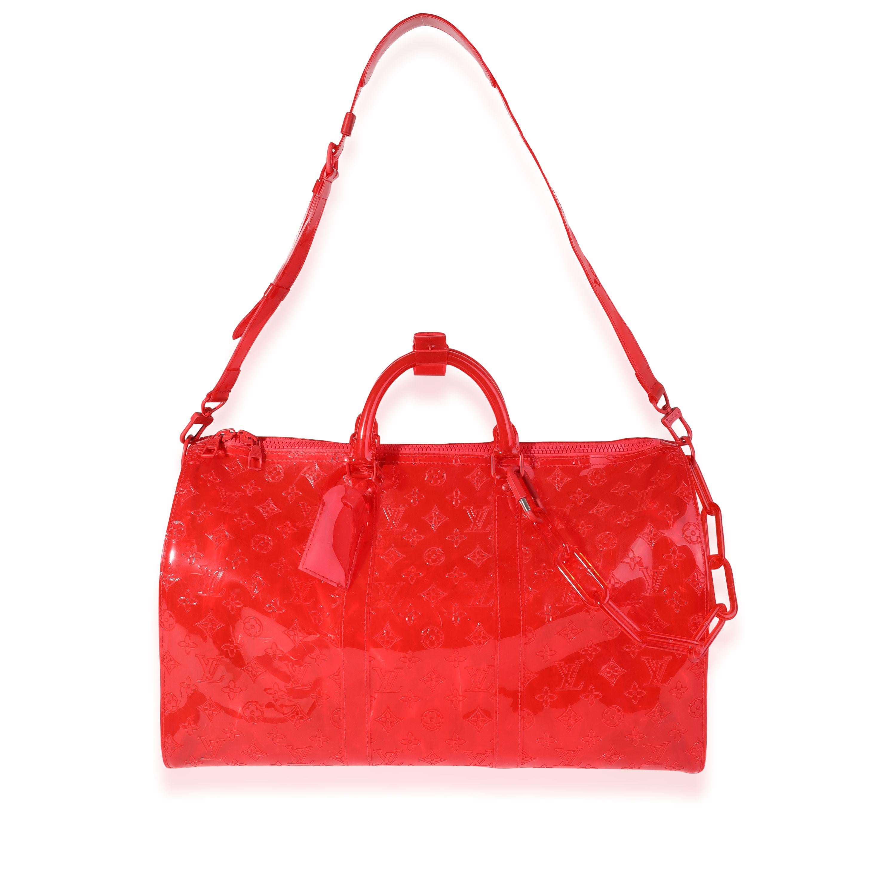 Listing Title: Louis Vuitton x Virgil Abloh Red Monogram PVC  Keepall Bandouliére 50
SKU: 120439
Condition: Pre-owned (3000)
Handbag Condition: Very Good
Condition Comments: Very Good Condition. Creasing, scuffing, and light discoloration to PVC.