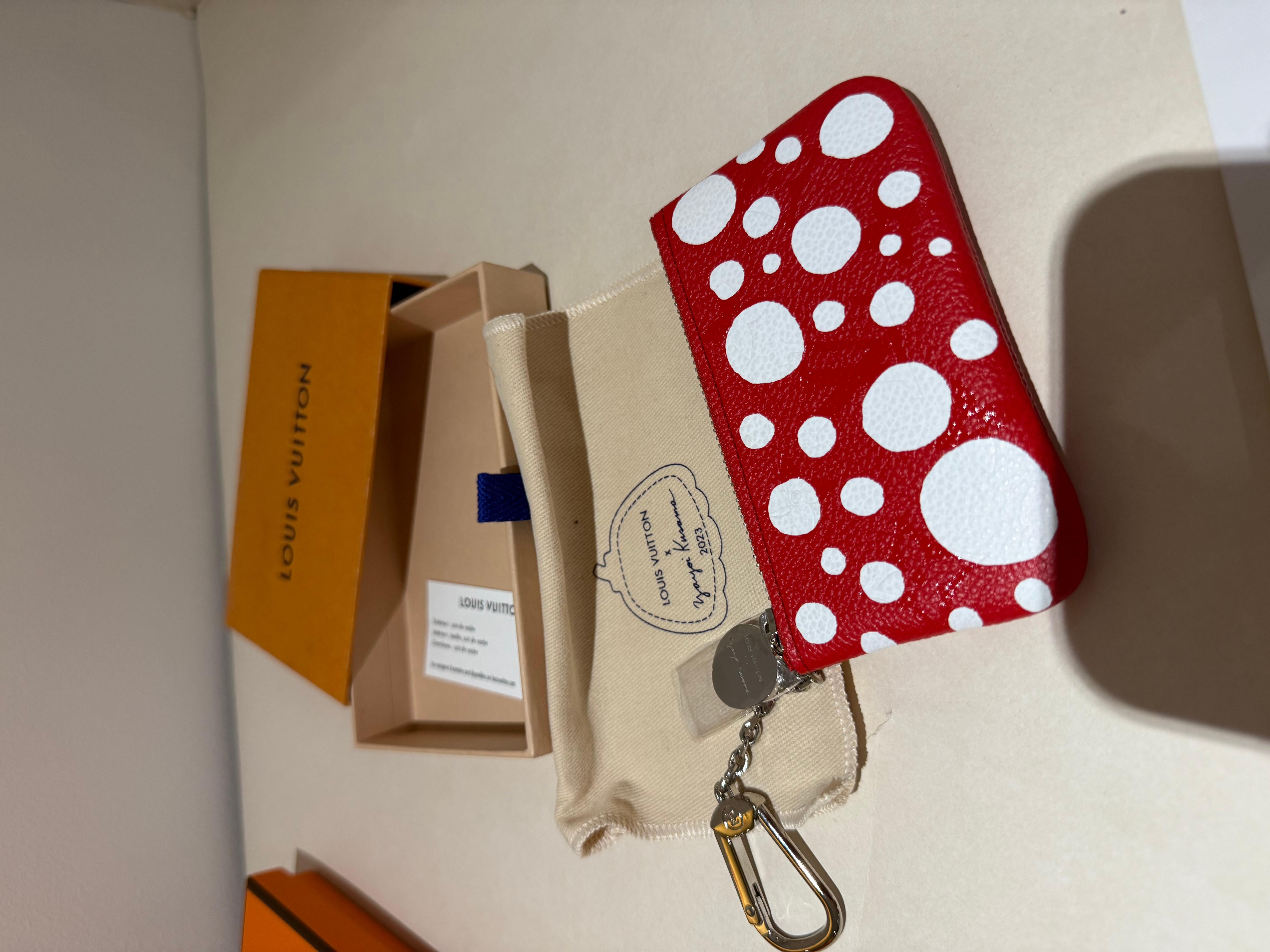 Louis Vuitton x Yayoi Kusama A Red Polka Dot Key Pouch, 2023. The Louis Vuitton Yayoi Kusama Pochette Cle is a stylish pouch designed in a striking red and white color scheme, crafted from Monogram Empreinte leather. 
Measuring 7cm x 11.5cm (2.75''