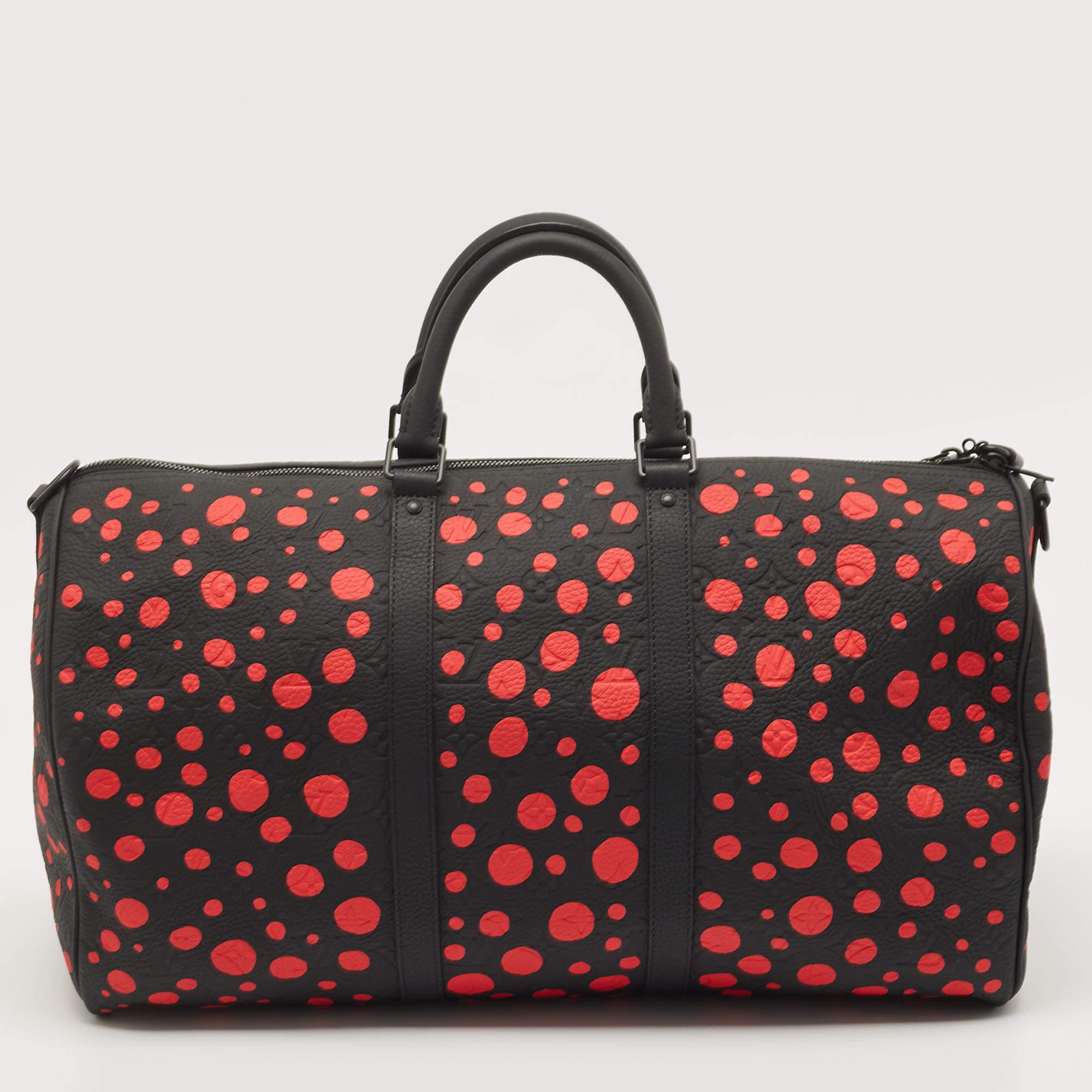 This Keepall 50 was made in collaboration with famed Japanese artist Yayoi Kusama. Dominated by the artist's signature polka dots, the bag makes a statement of art and fashion. This Keepall 30 is from that limited range, and it has been crafted from