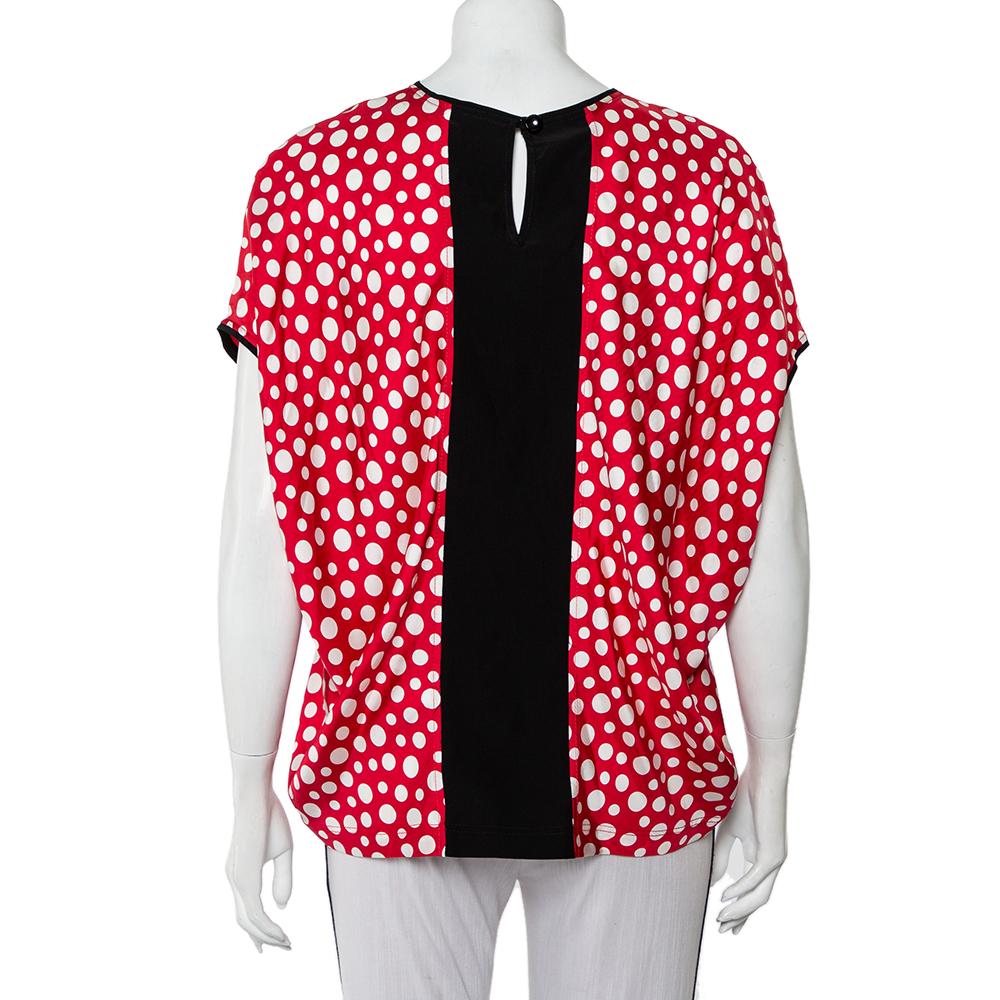 If you're looking for a statement top, we've got just the one you need! It is a design by Louis Vuitton made in collaboration with Yayoi Kusama. The silk top is tailored into an oversized style and enhanced with Kusama's signature dots printed all