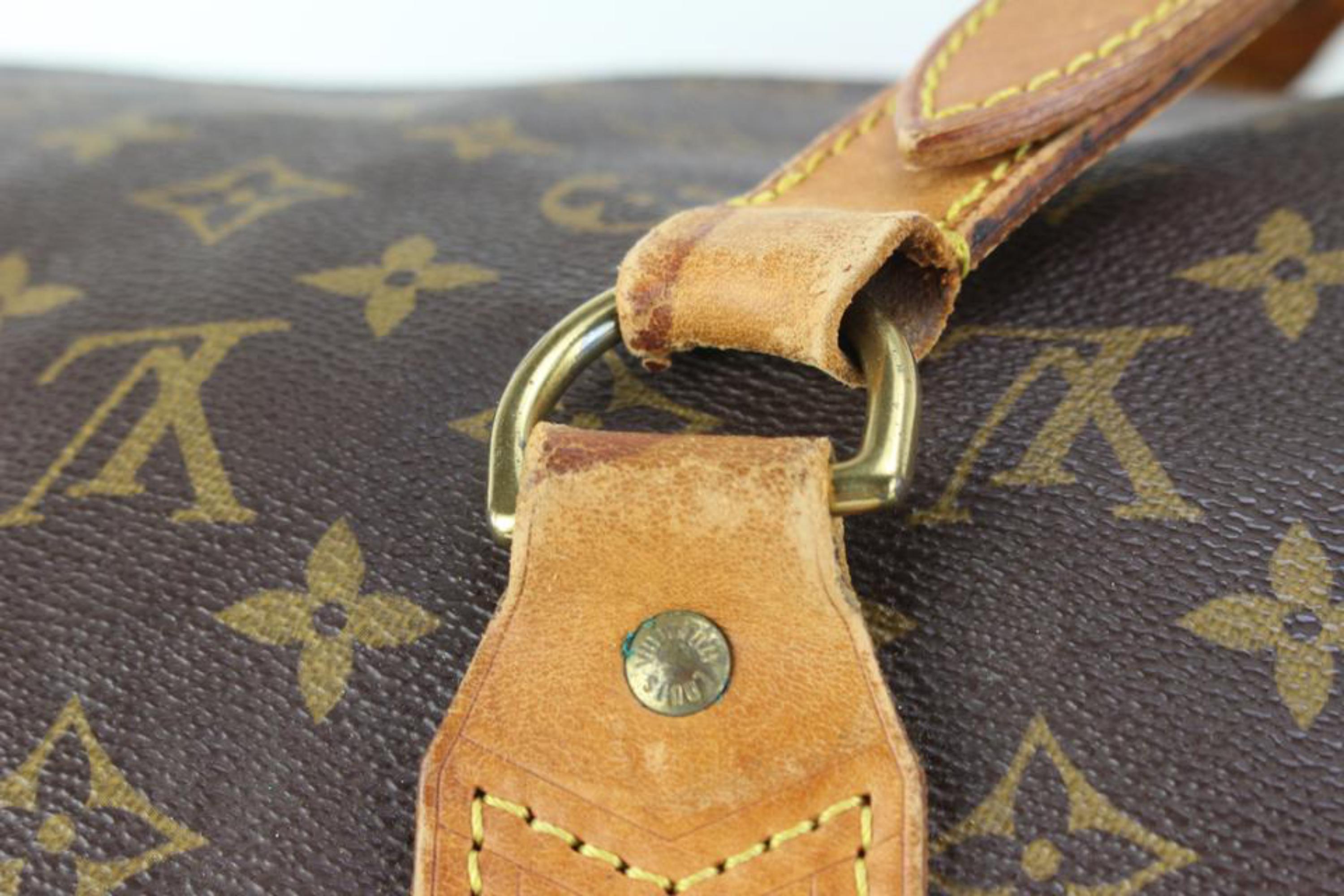 Louis Vuitton XL Monogram Sac Polochon 70 Keepall Bandouliere 64lz429s In Fair Condition For Sale In Dix hills, NY