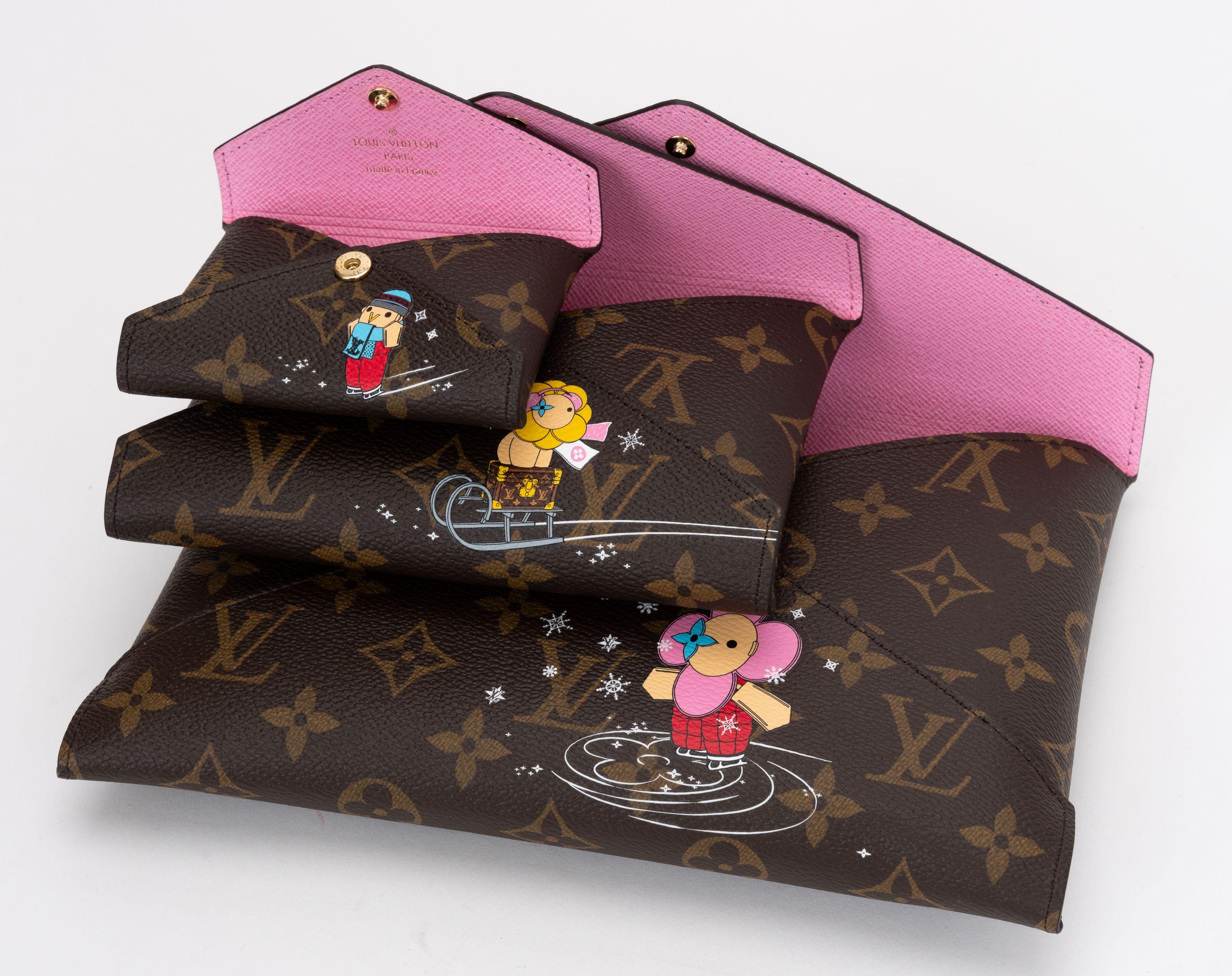 Louis Vuitton Kirigami Pochettes are made from Monogram coated canvas with a pink interior leather. There are three envelopes that slip into each other. Each envelope is adorned with a print of House Mascot Vivienne. Christmas 2023 limited edition.